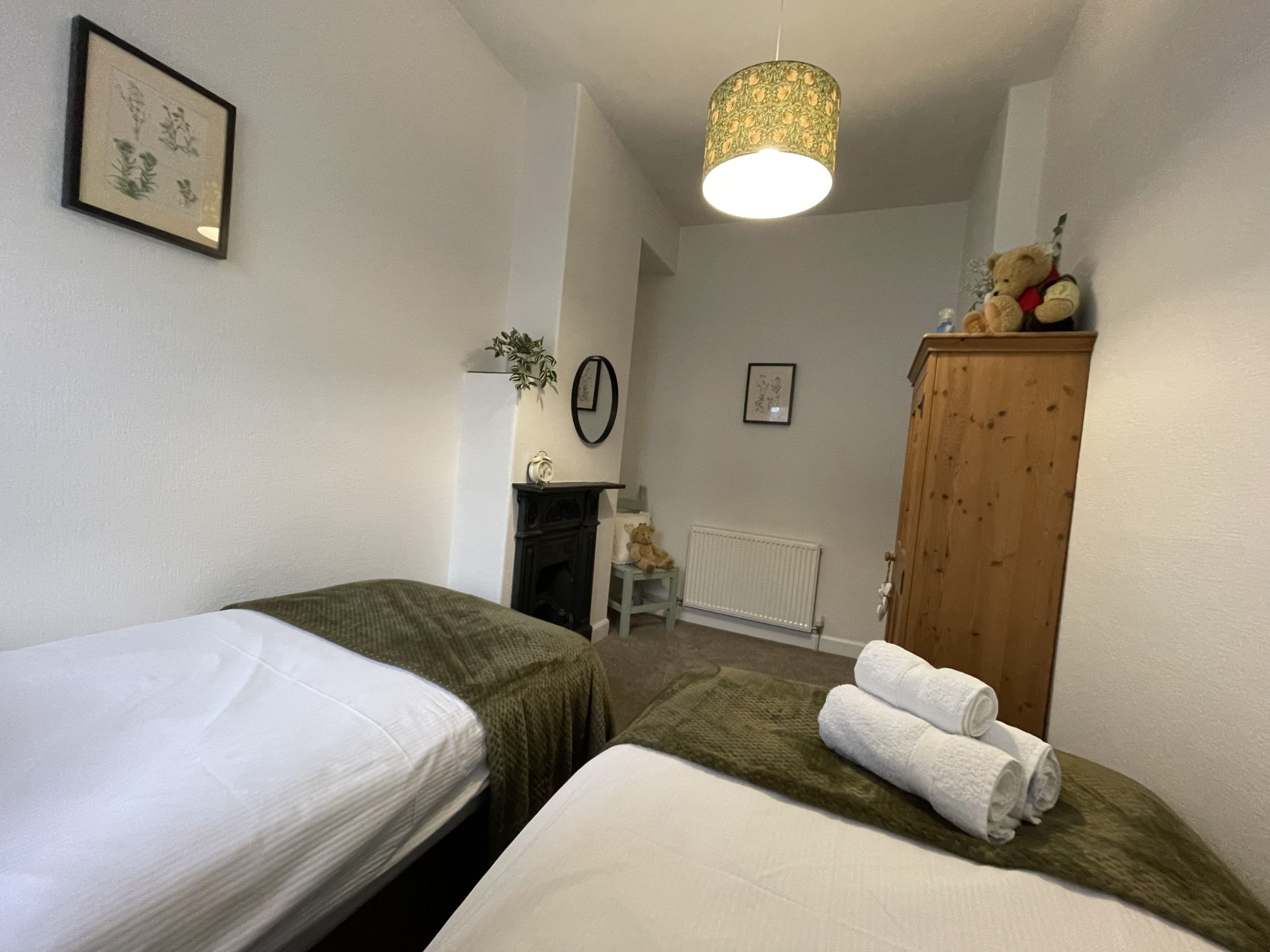 The twin room has lots of character, and features a beautiful decorative fireplace