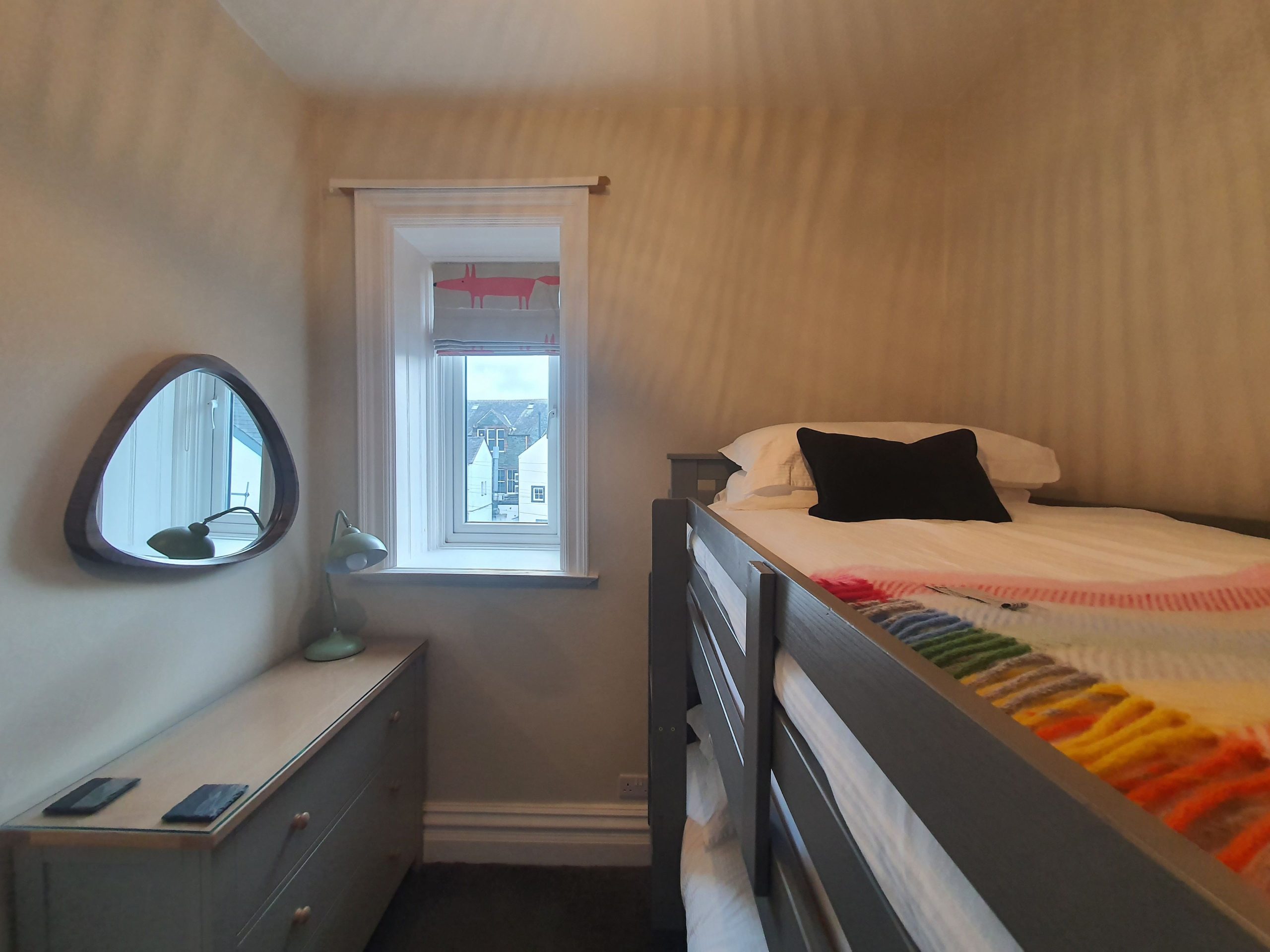 The compact second bedroom is furnished with a bunk bed - perfect for those travelling with children