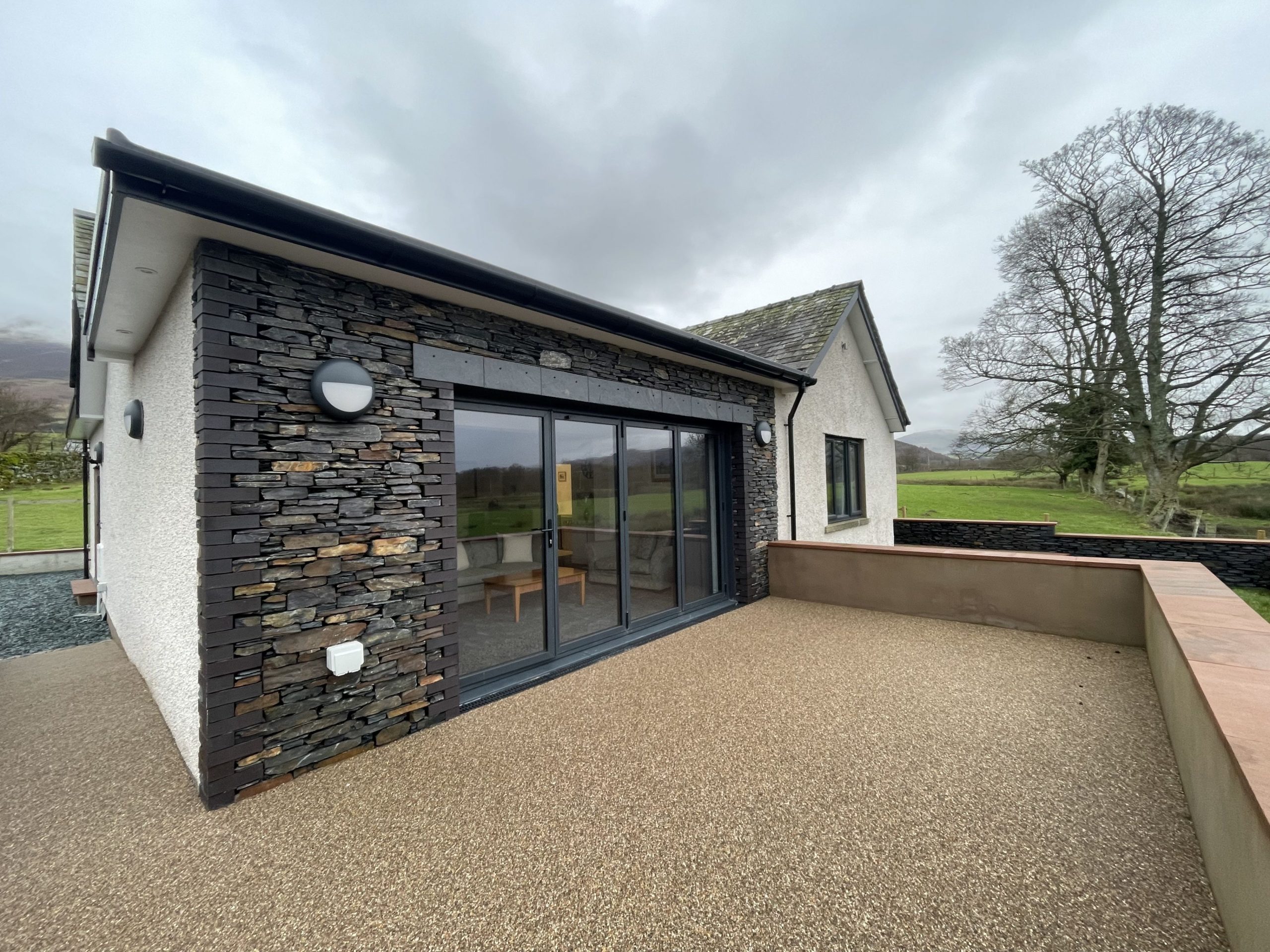 The modern bungalow uses the traditional slate stones found in many properties throughout the area