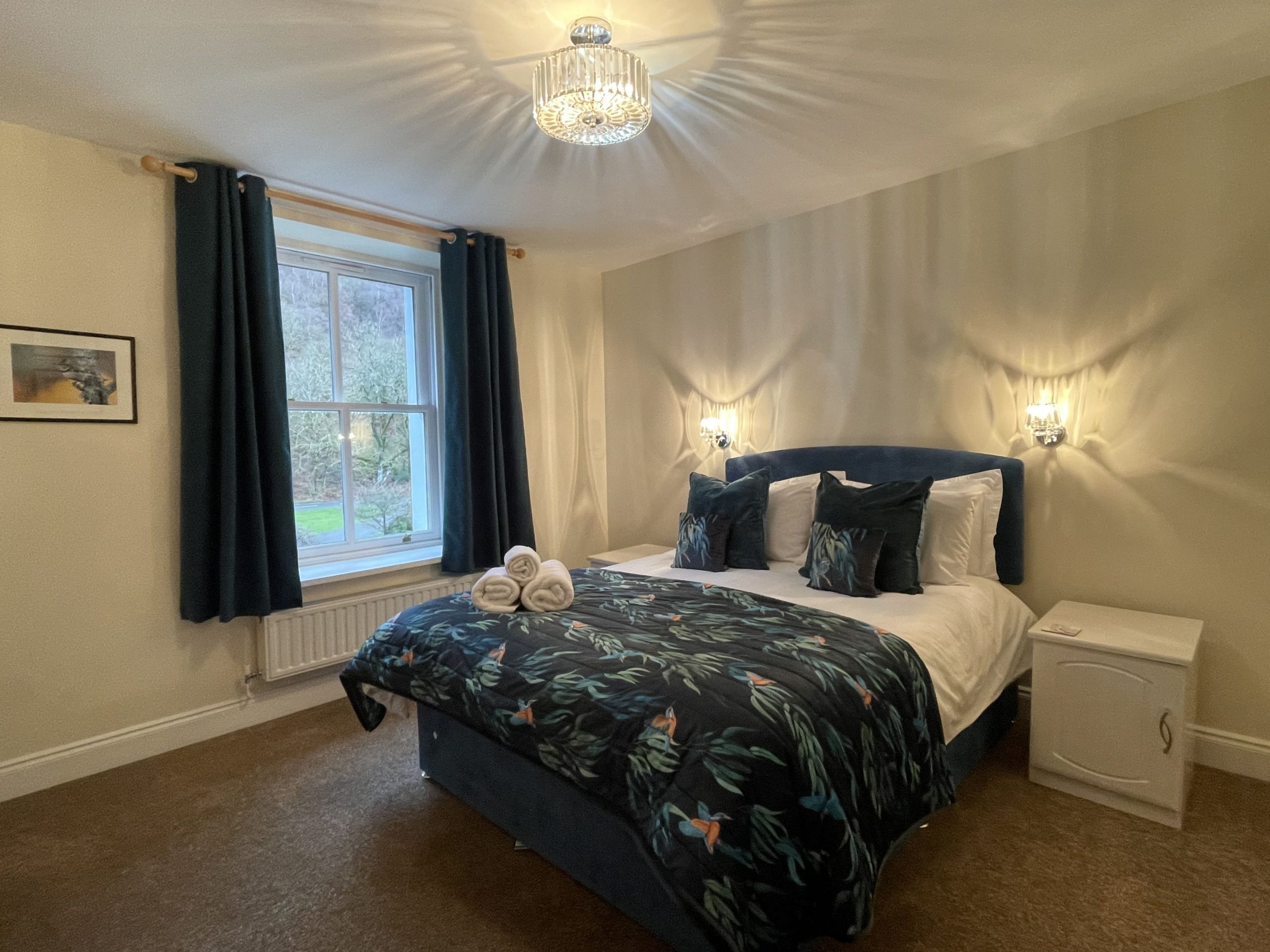 The tastefully decorated master bedroom has a king sixed bed and fitted wardrobes