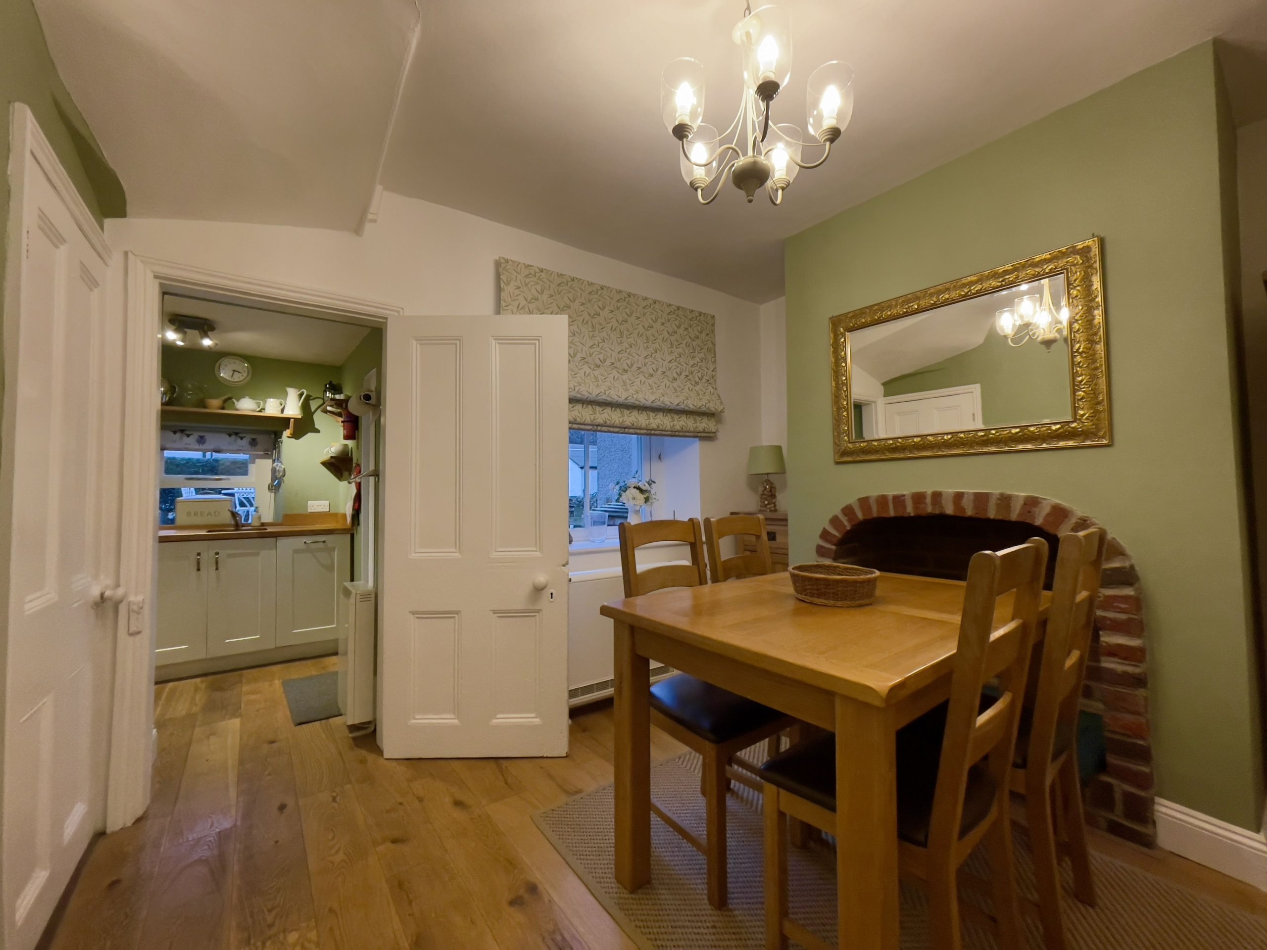 The fireplace has been repurposed and makes an excellent nook for the pooch to sleep - a dog bed is provided
