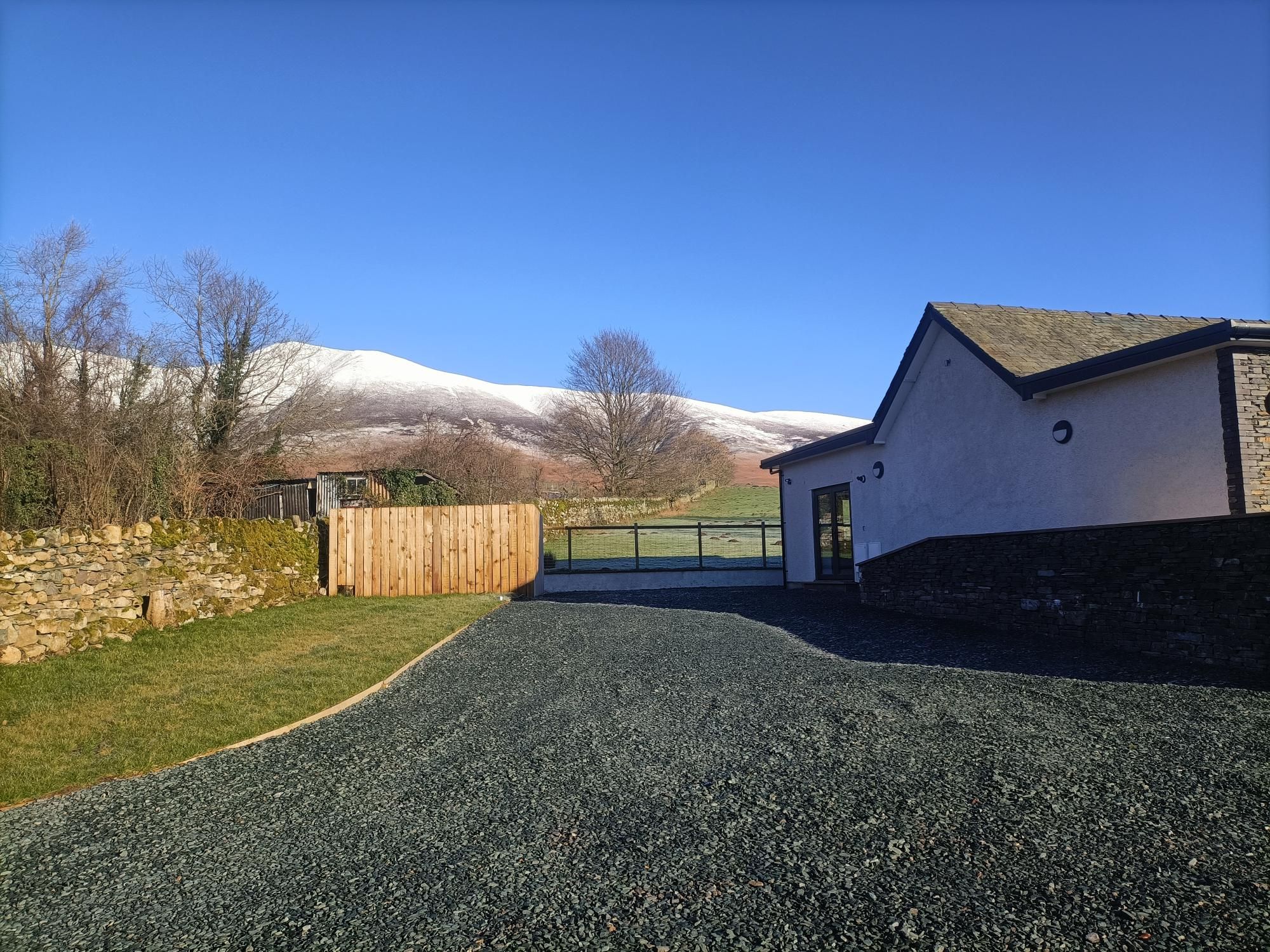 Snow capped fells on a sunny day at Langrigg Cottage