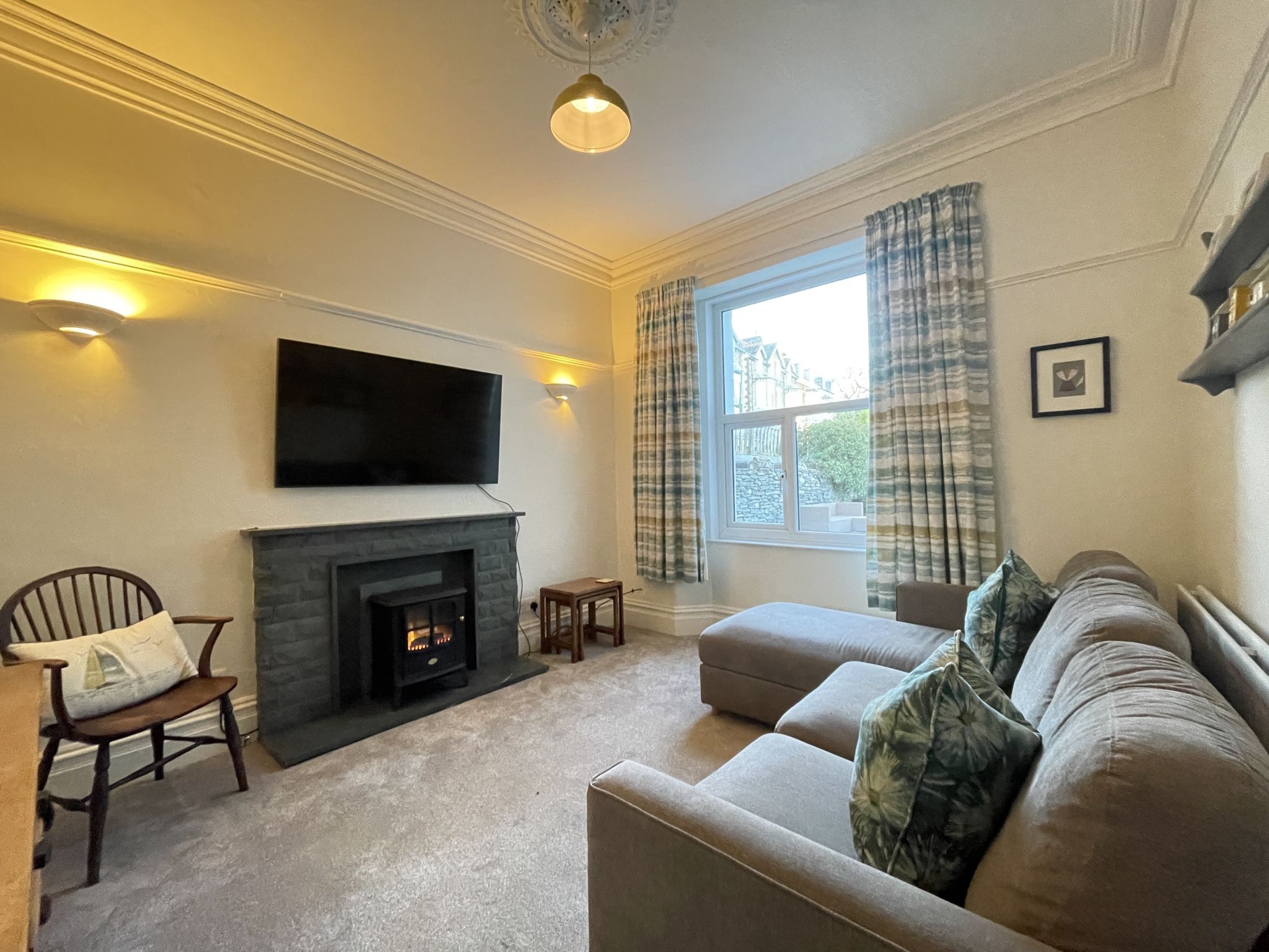 The rear reception room features an electric fire