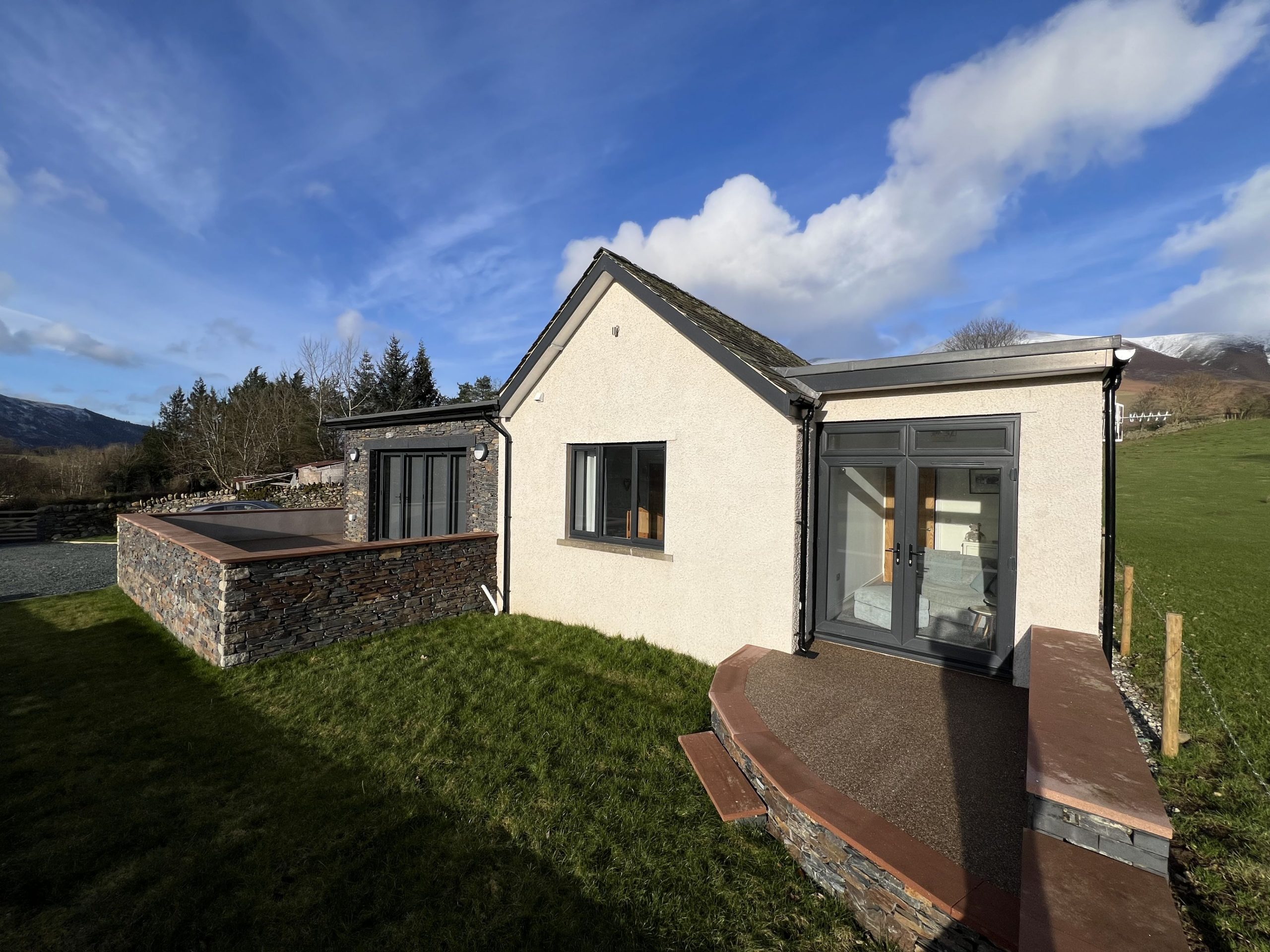 The snug also enjoys double doors out to a patio area