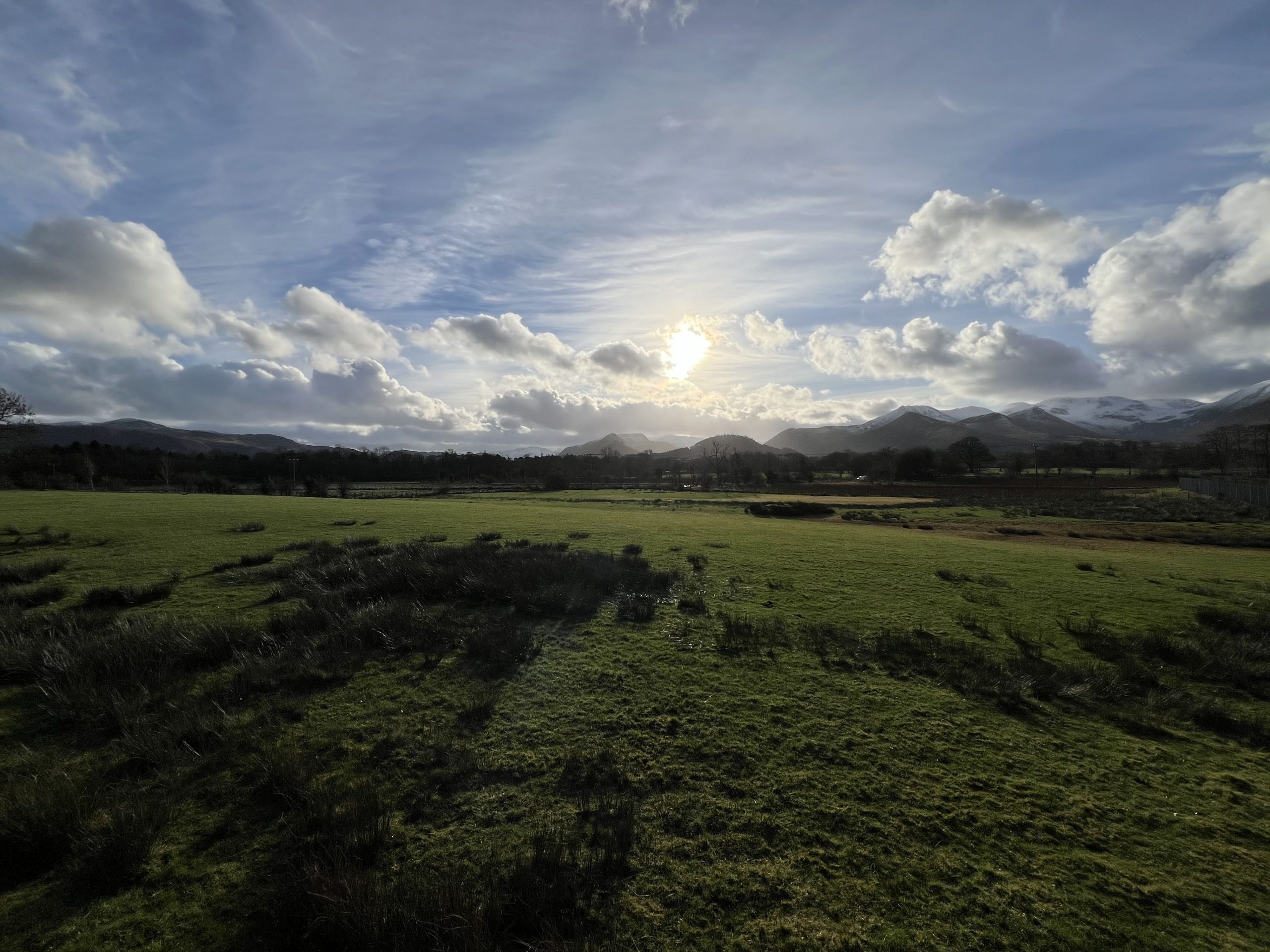 The sun poking through the clouds on a Winter's afternoon
