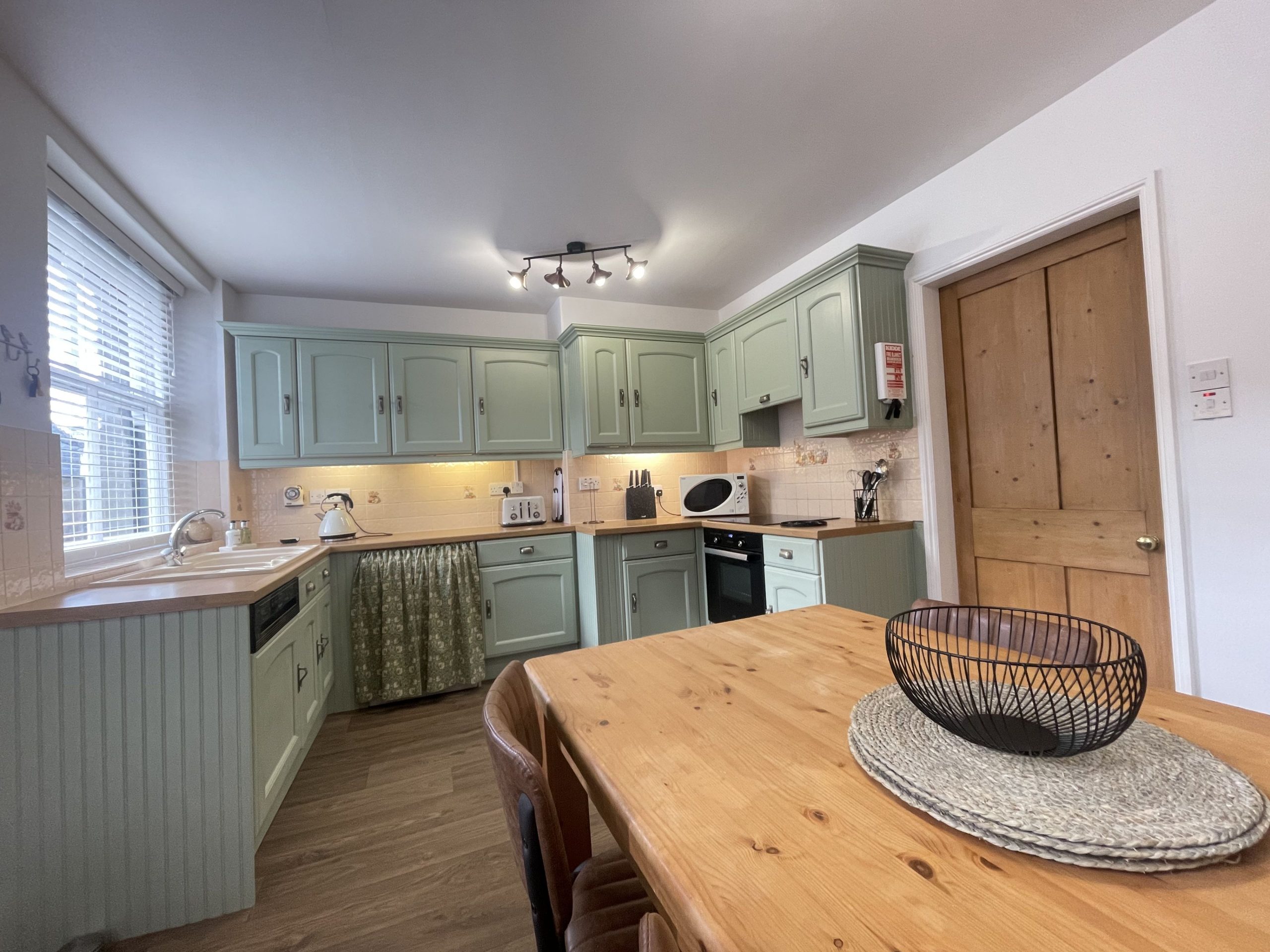 Under stair storage provides plenty of room for boots and coats