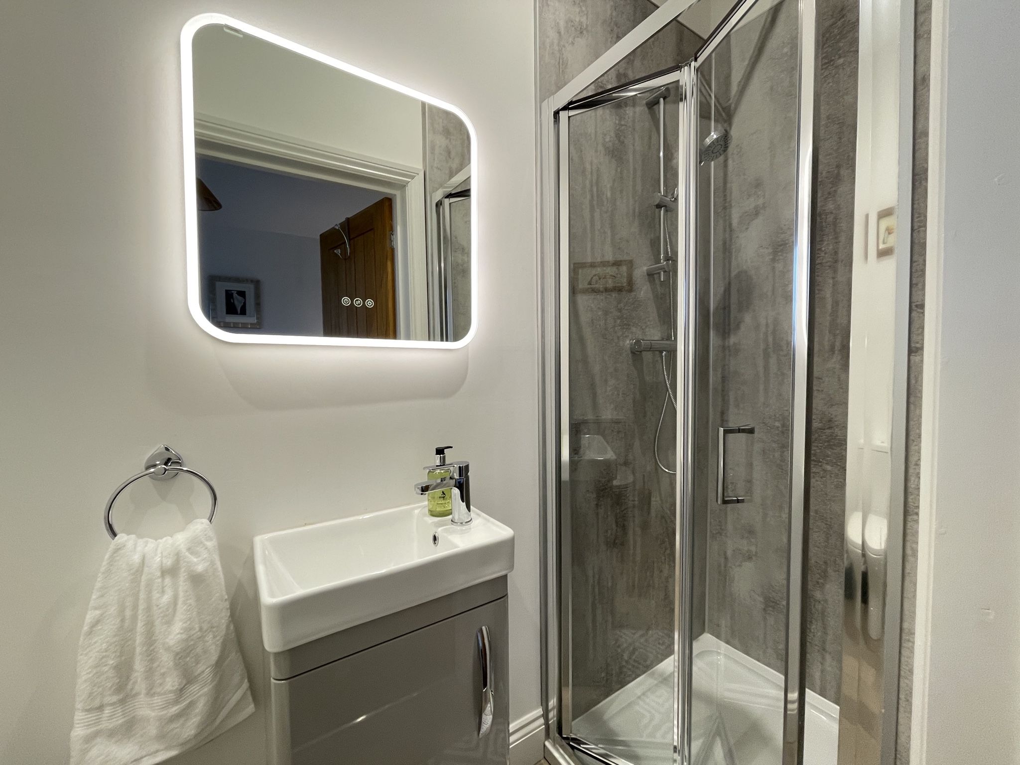 The ensuite has a walk in shower, hand basin and WC