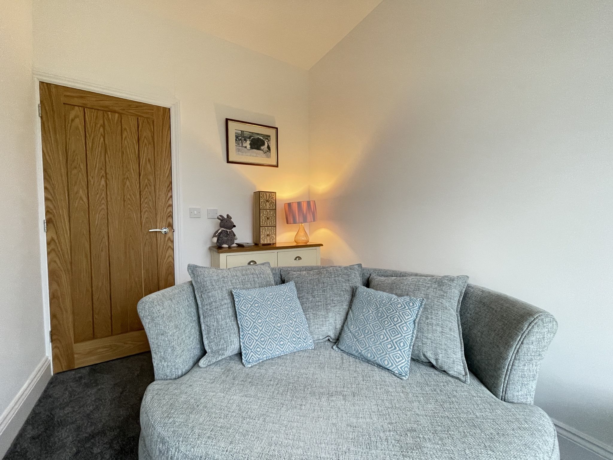 At the far end of the hall you will find a lovely snug, where you can curl up with a good book or just kick back and admire the view