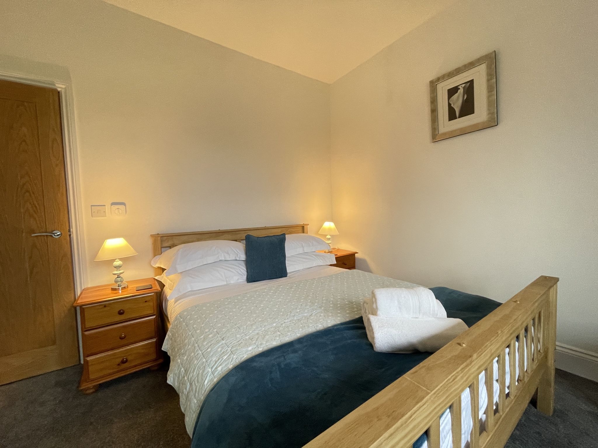 The master bedroom has a king sized bed and ensuite shower room