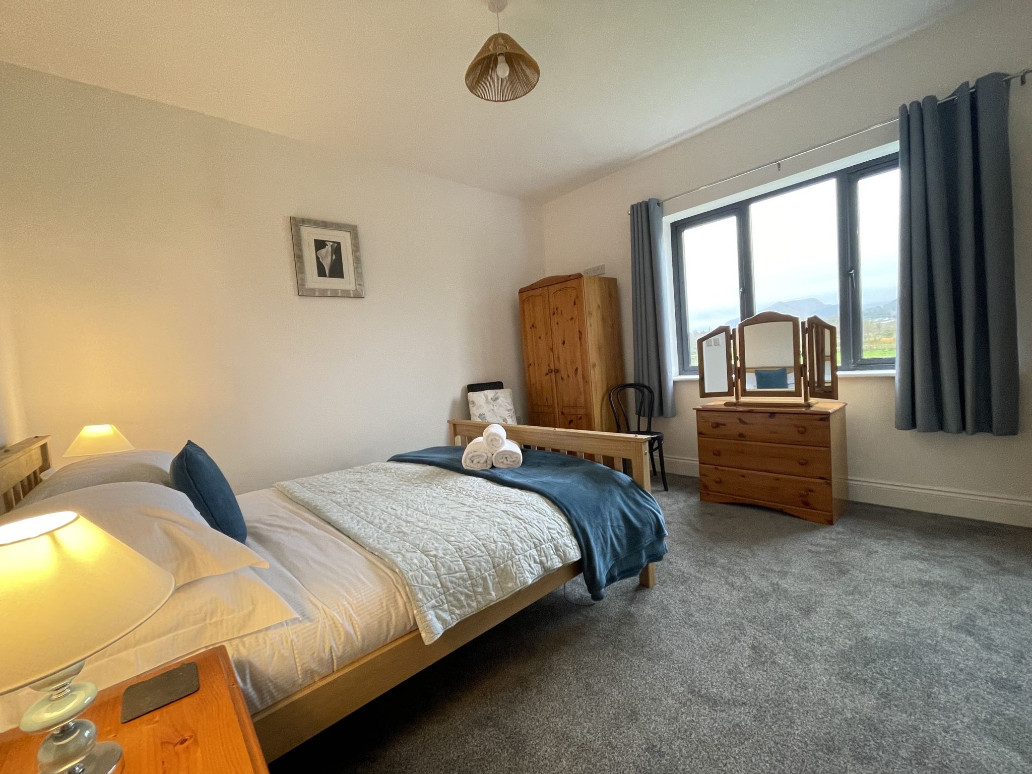 The master bedroom is at the front of the property, enjoying the views of the north-western fells