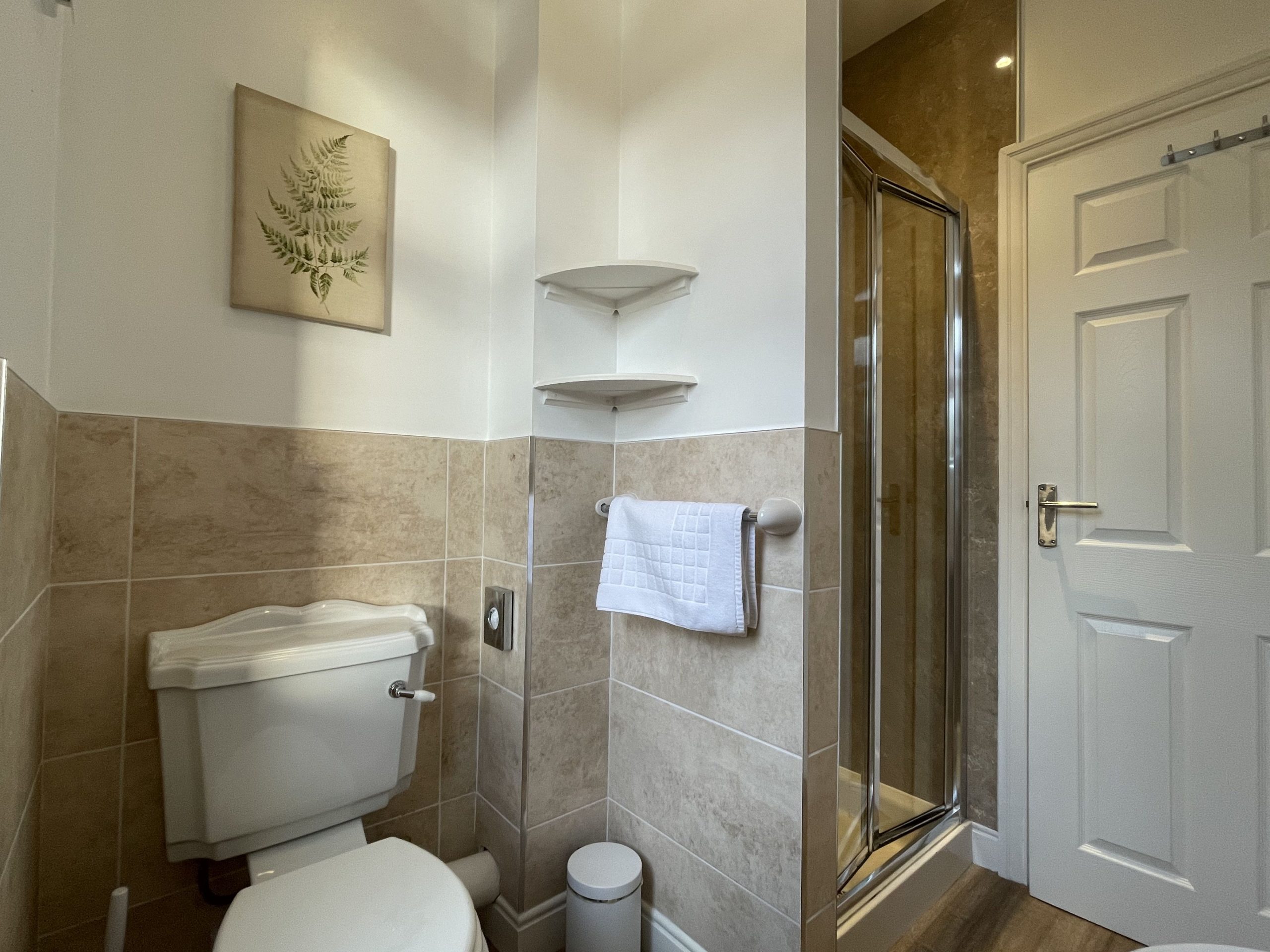 The ensuite comprises walk in shower, WC and hand sink