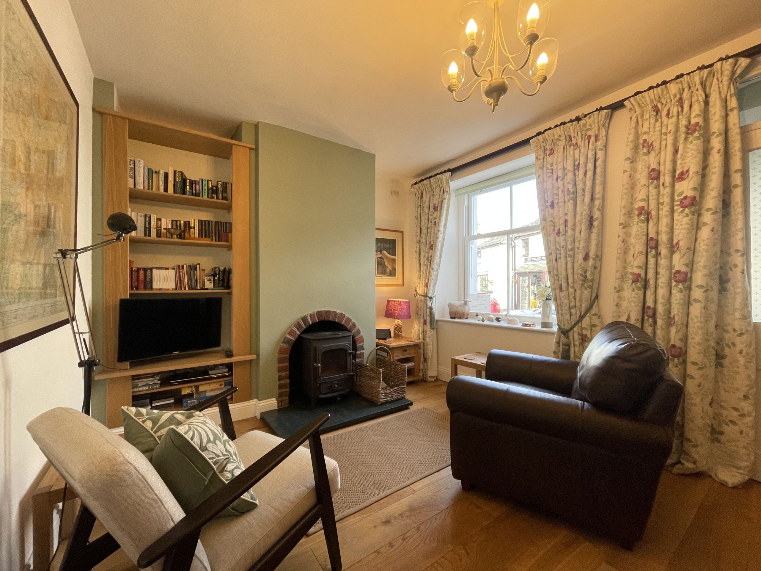 From the porch, you enter the lovely cosy front room which is decorated tastefully in a true cottage style