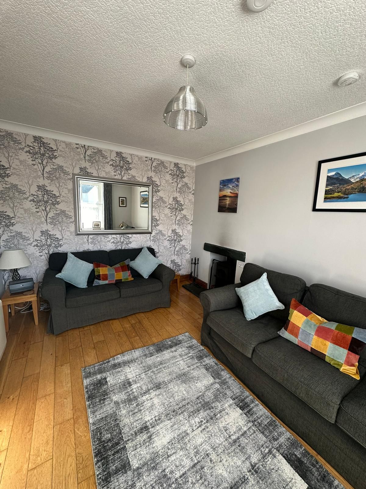 The modern, light living room has matching 3 and 2 seater settees, TV with Now TV Smart Box (which includes access to Netflix) and DVD player