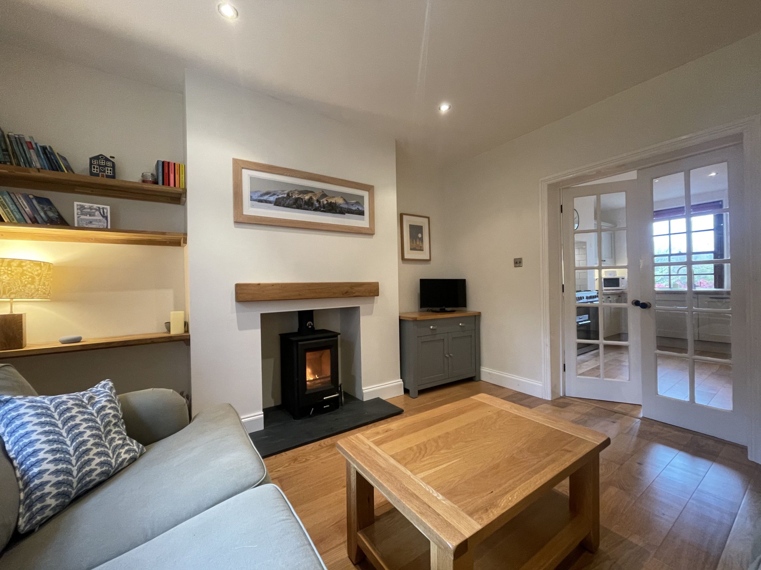 French doors lead from the living area to the kitchen
