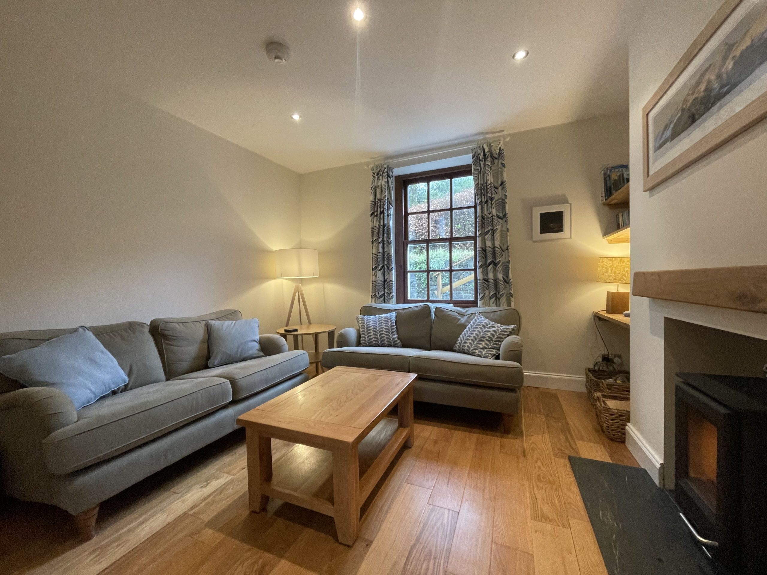 A beautifully decorated living area at the rear of the property