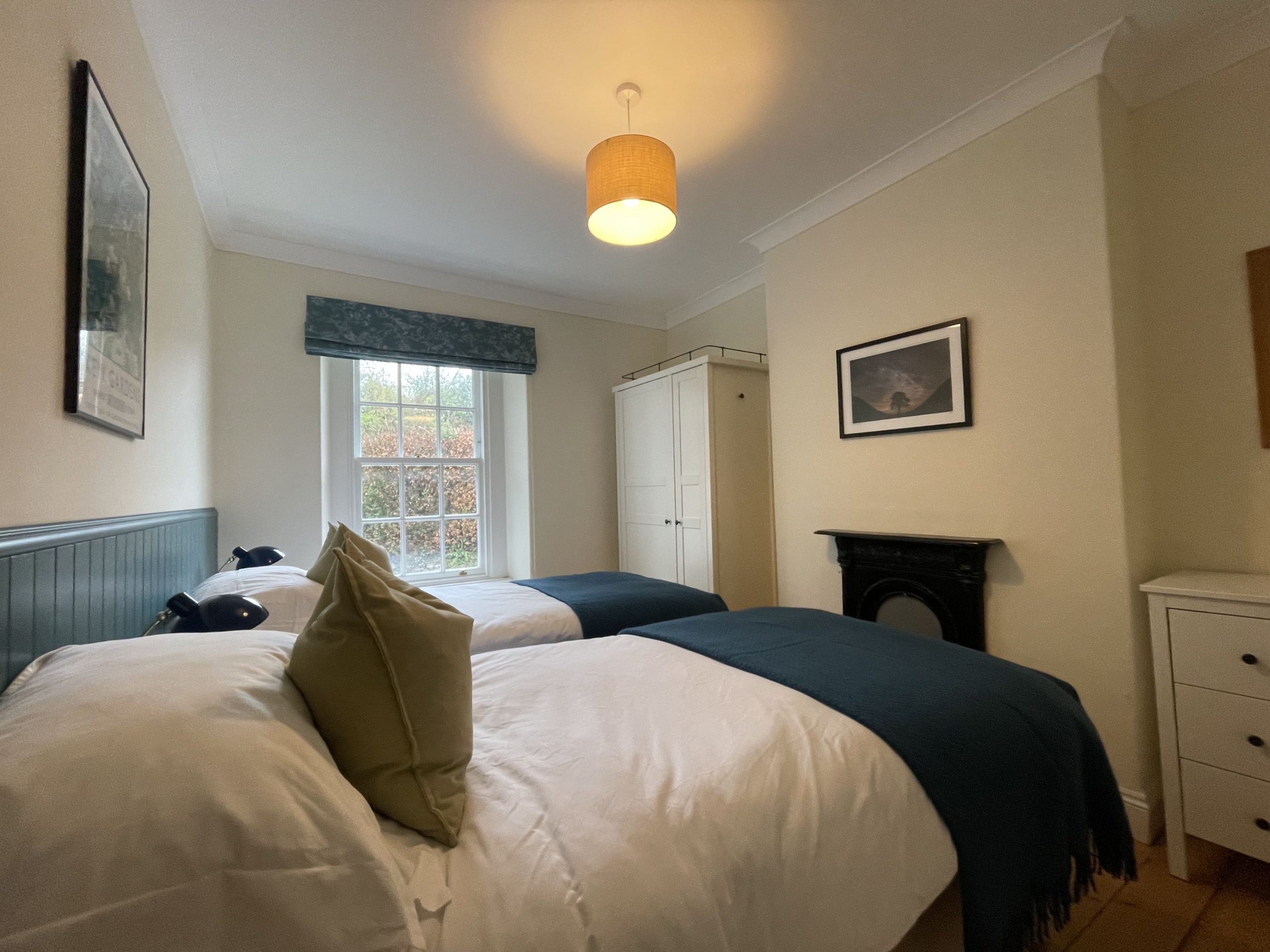 Photos and posters of local Lake District landmarks decorate the walls of the cottage