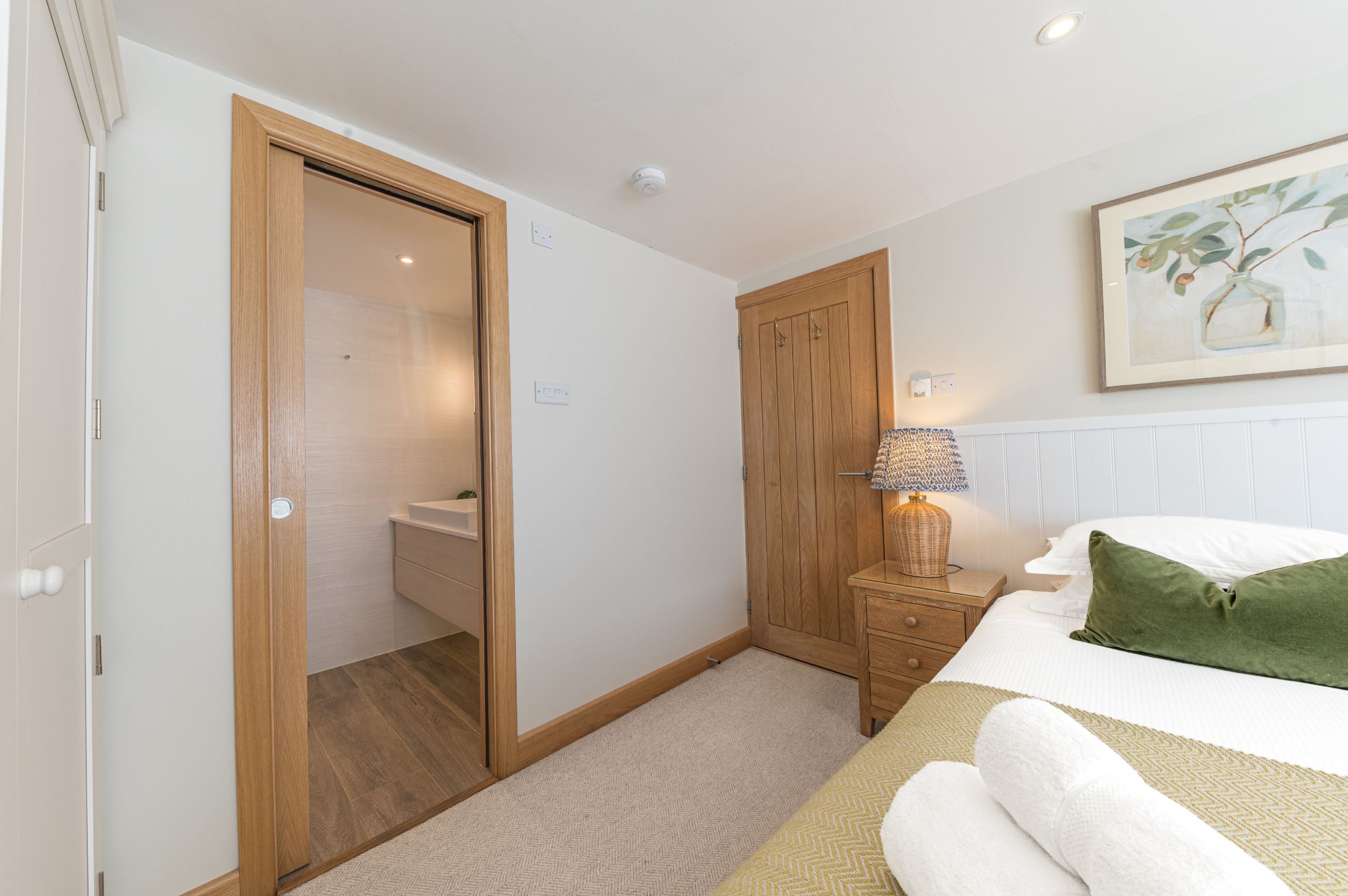 The bedroom has an ensuite shower room