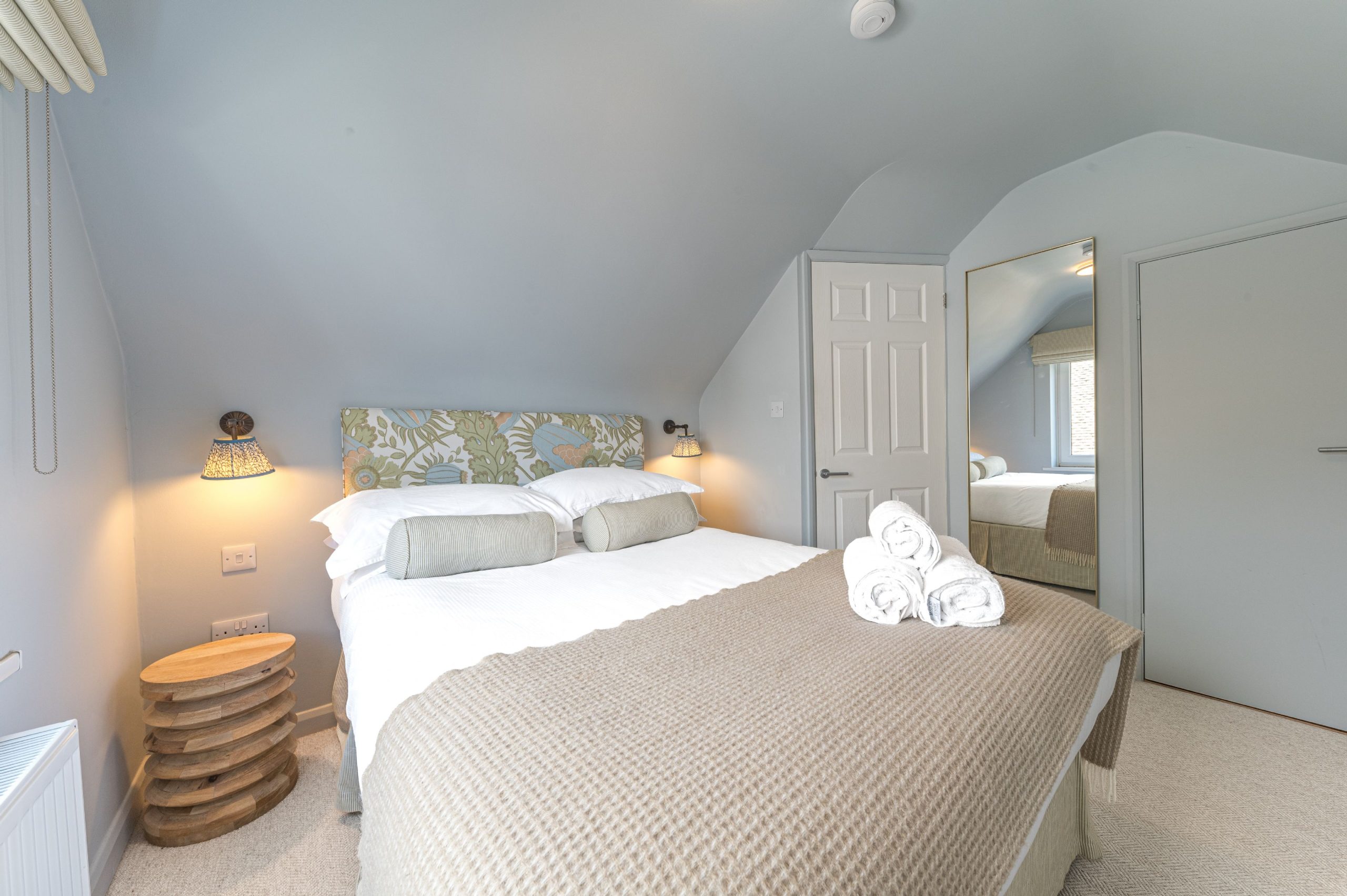 This bedroom is furnished with a double bed and drawers, and also features a built in closet