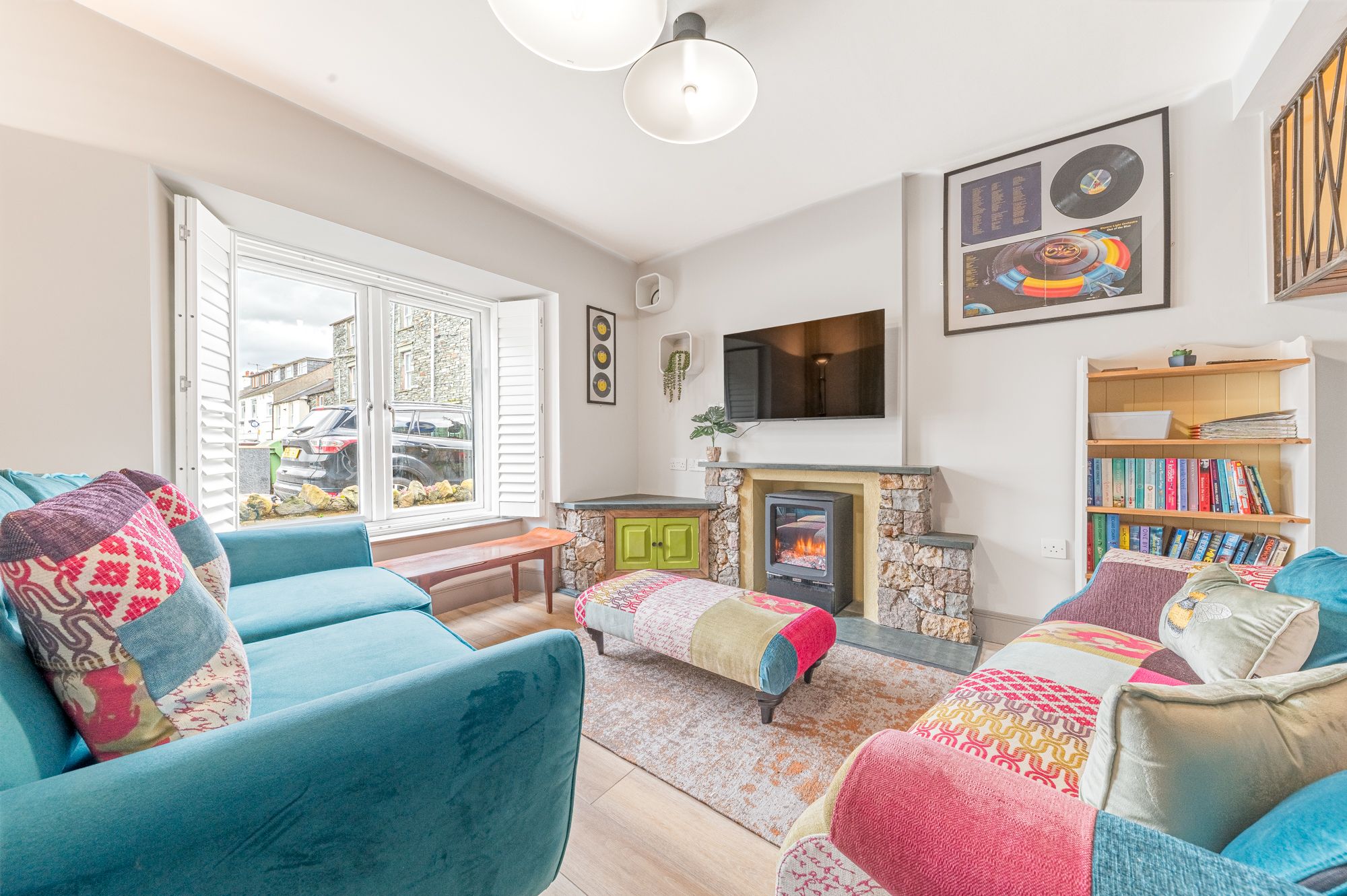 The cosy front room is light and bright, the perfect space for everyone to relax