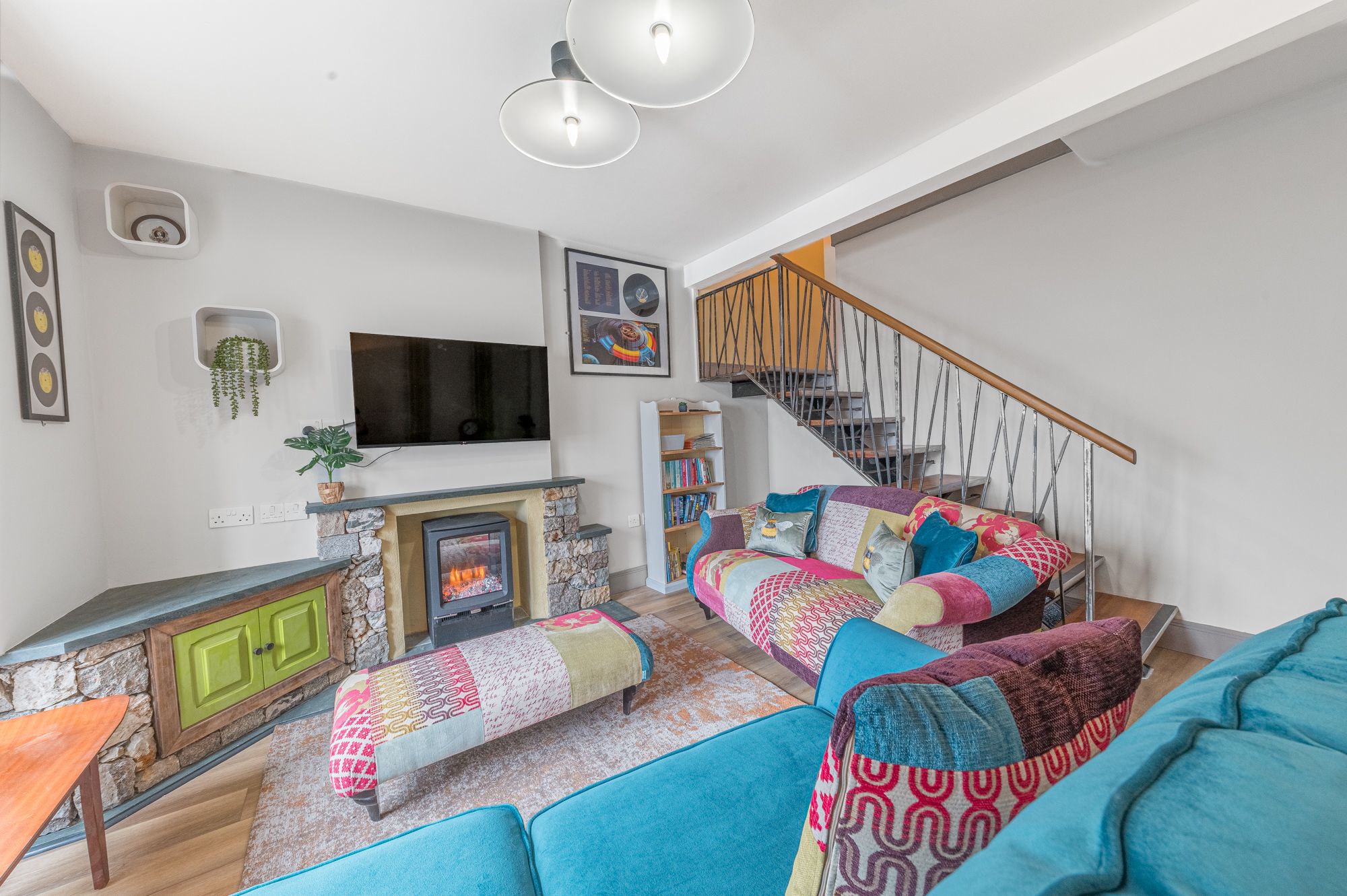 The living room has a living flame electric fire to keep you toasty in the colder months