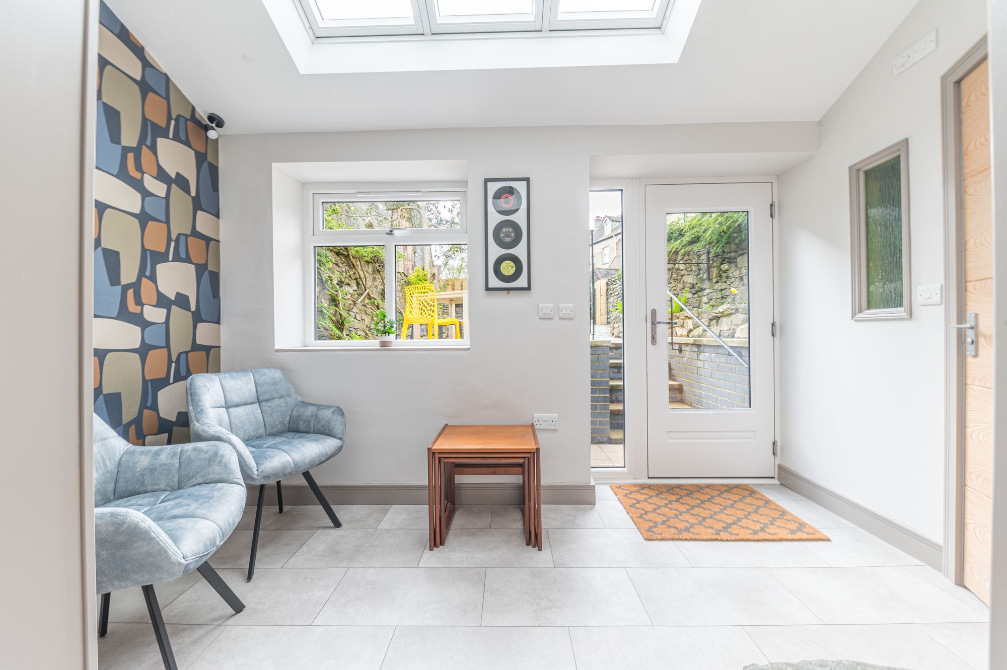 At the rear of the property you can find a pleasant sun room, the perfect reading space