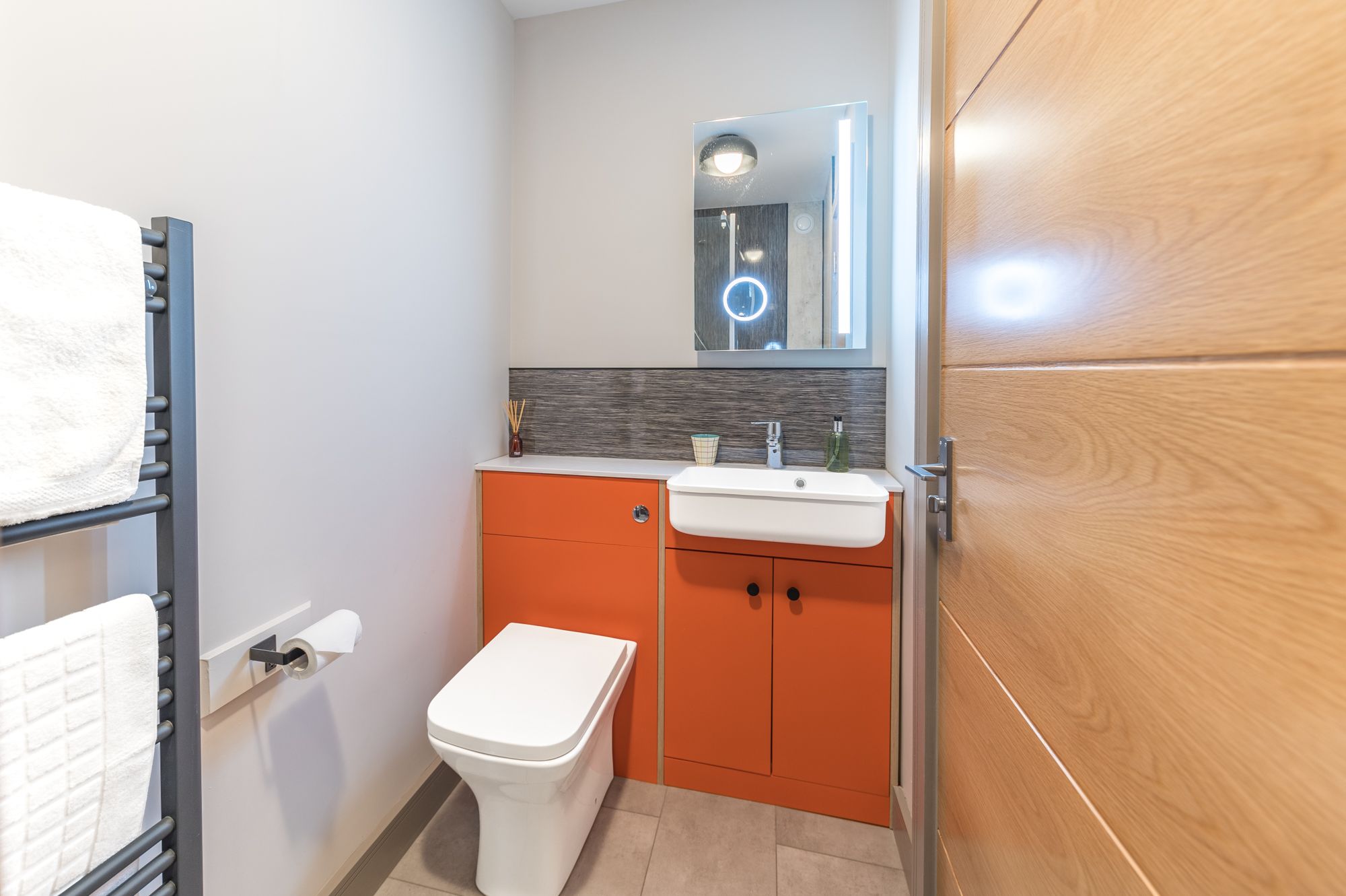 The 70's colour scheme continues through to the ensuite shower room