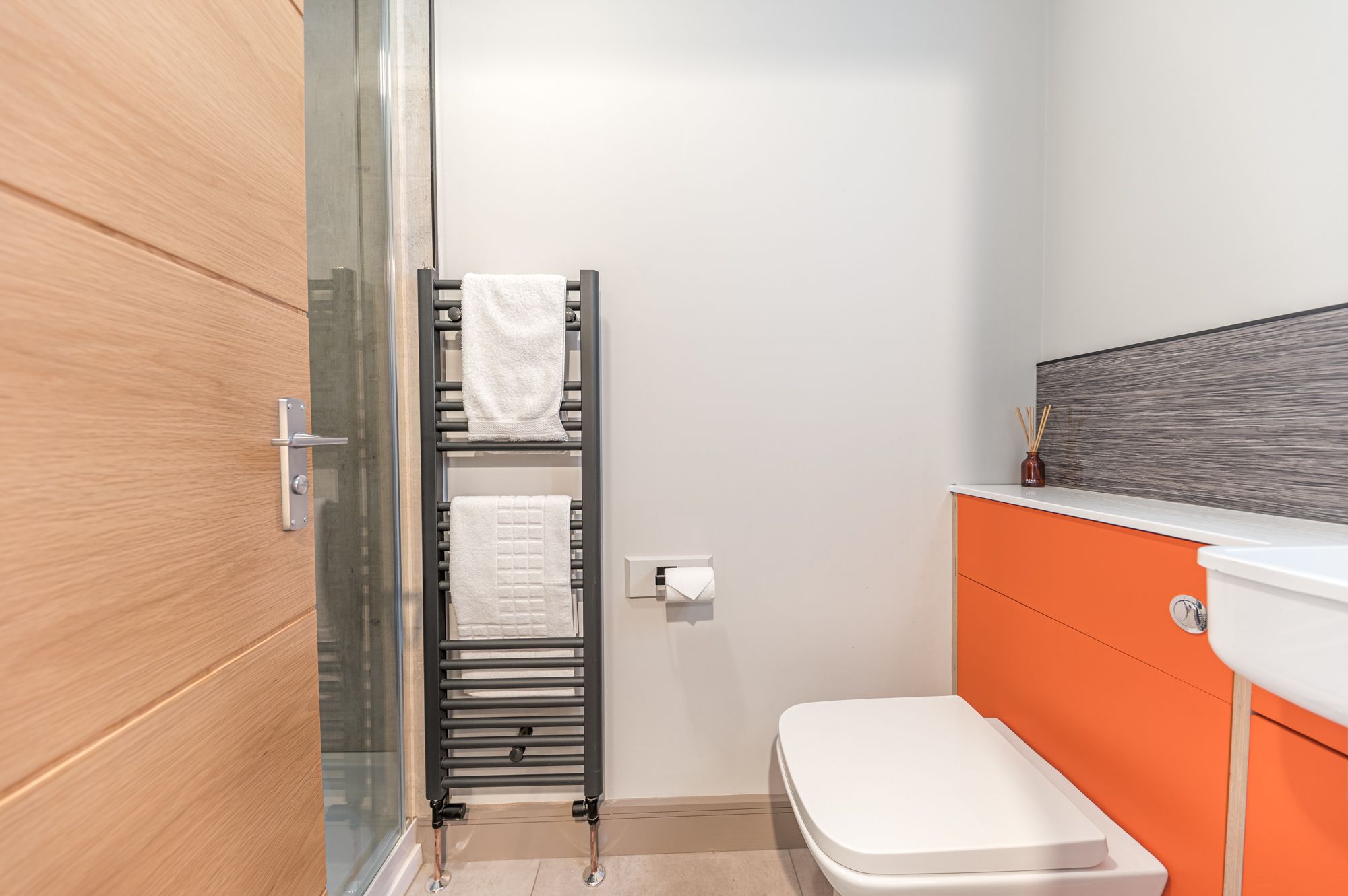 You will find a walk in shower, hand sink, WC and heated towel rail in the ensuite