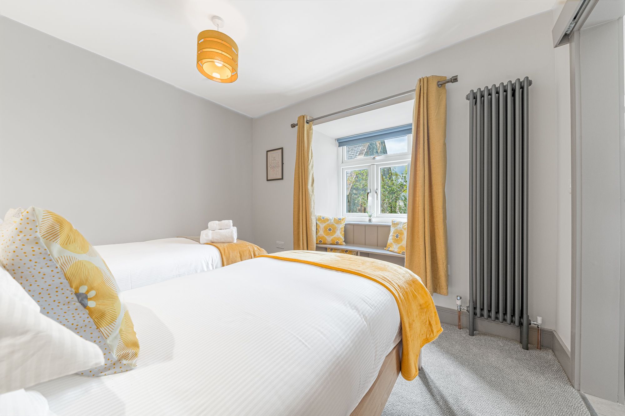 The twin room is to the rear of the property, with views over the garden