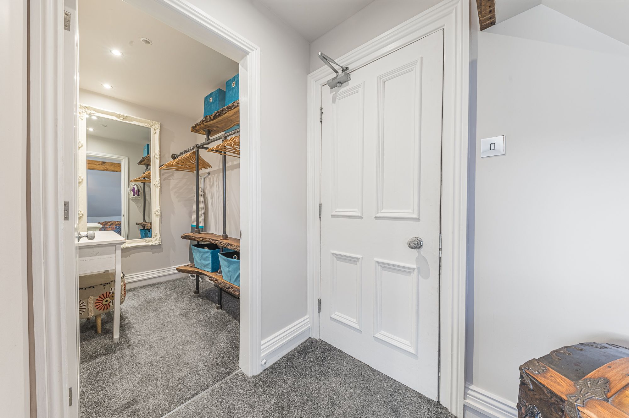 The walk in wardrobe is to the right hand side of the entrance to the master bedroom