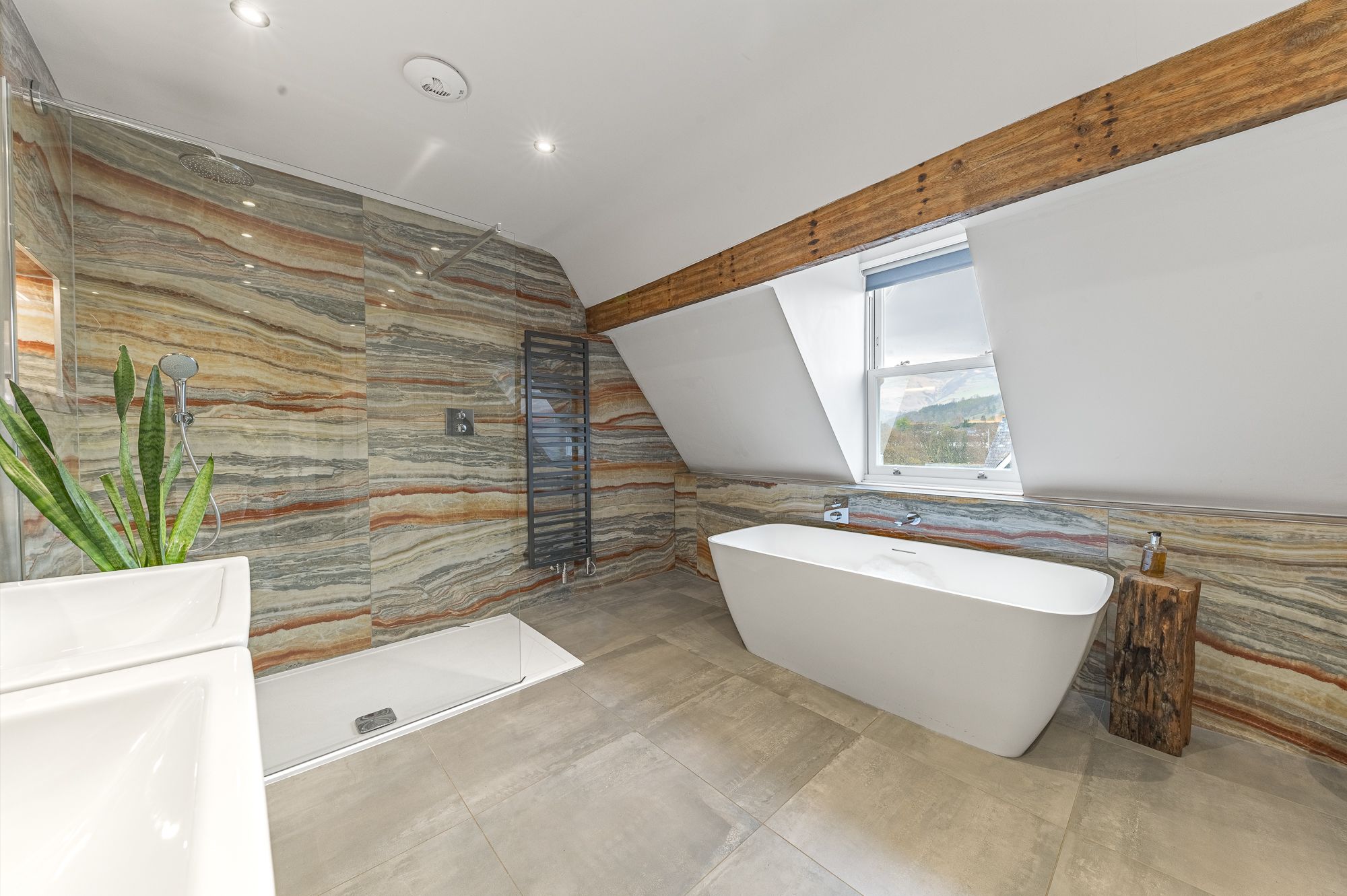 The penthouse suite boasts a massive bathroom with a view