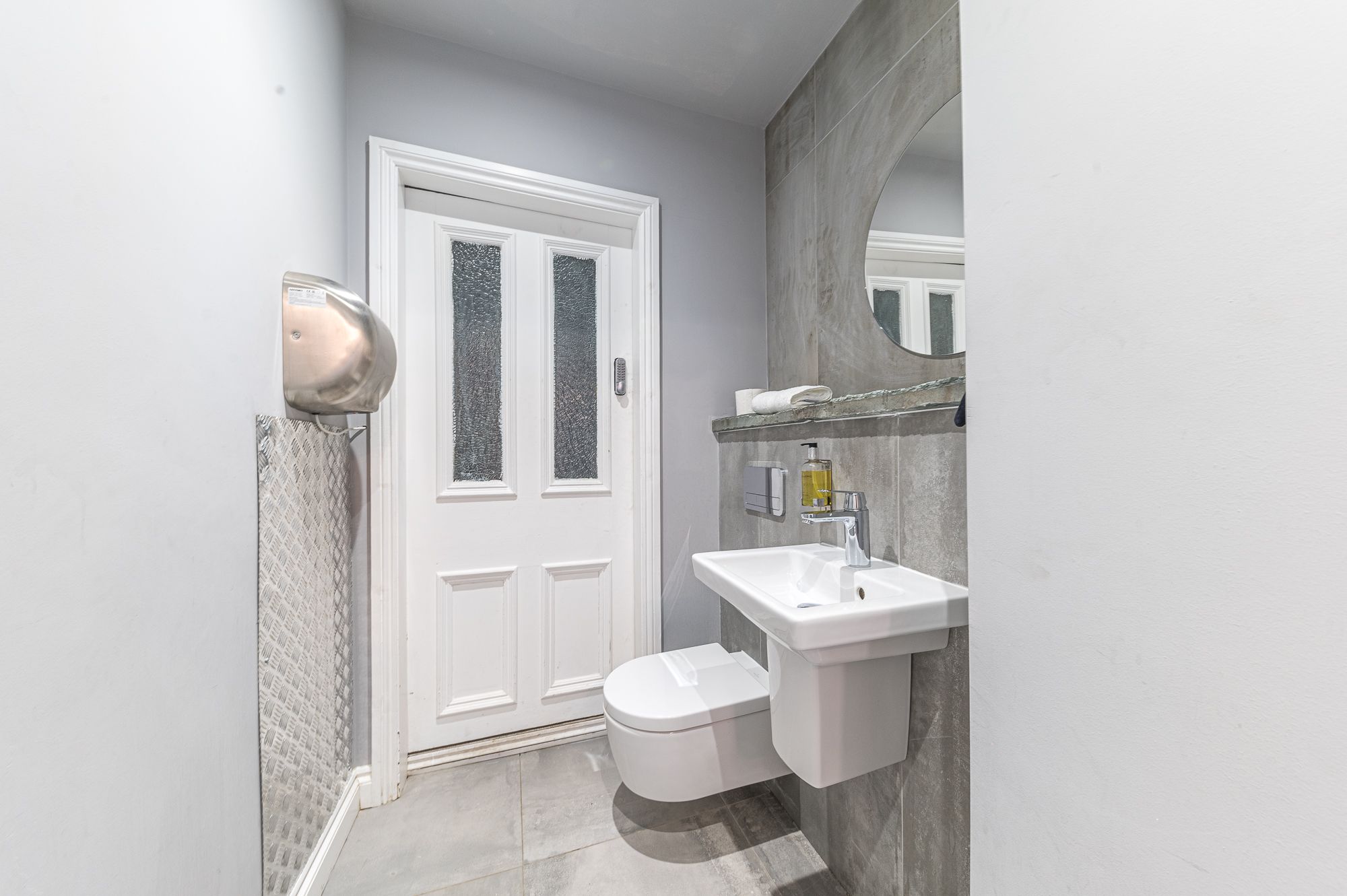 The WC is located just off the staircase before reaching the 1st floor