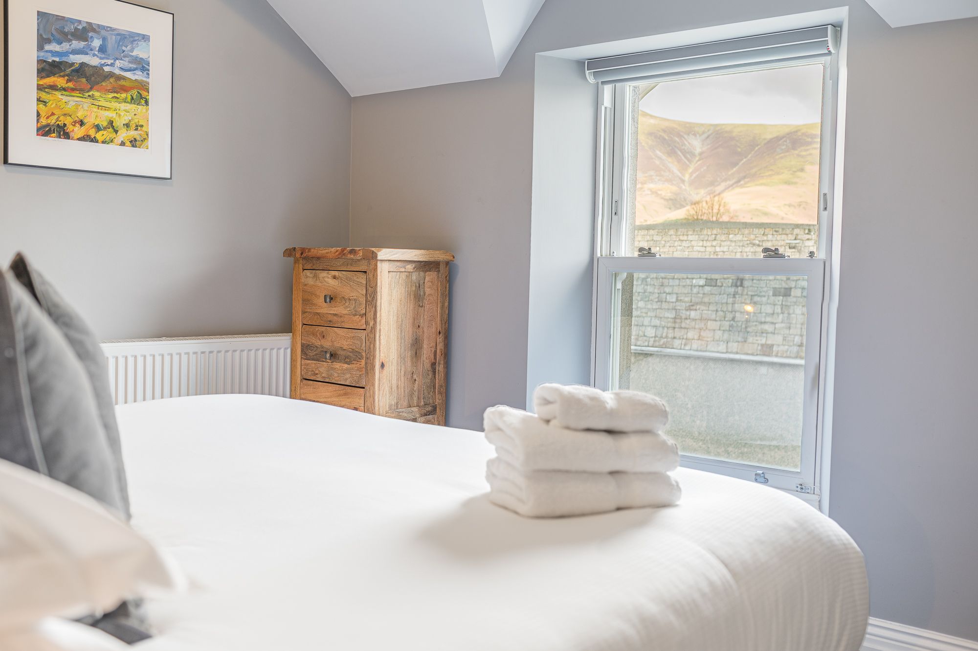 This room features a super-king sized bed and has views over Victoria Street and the Skiddaw range