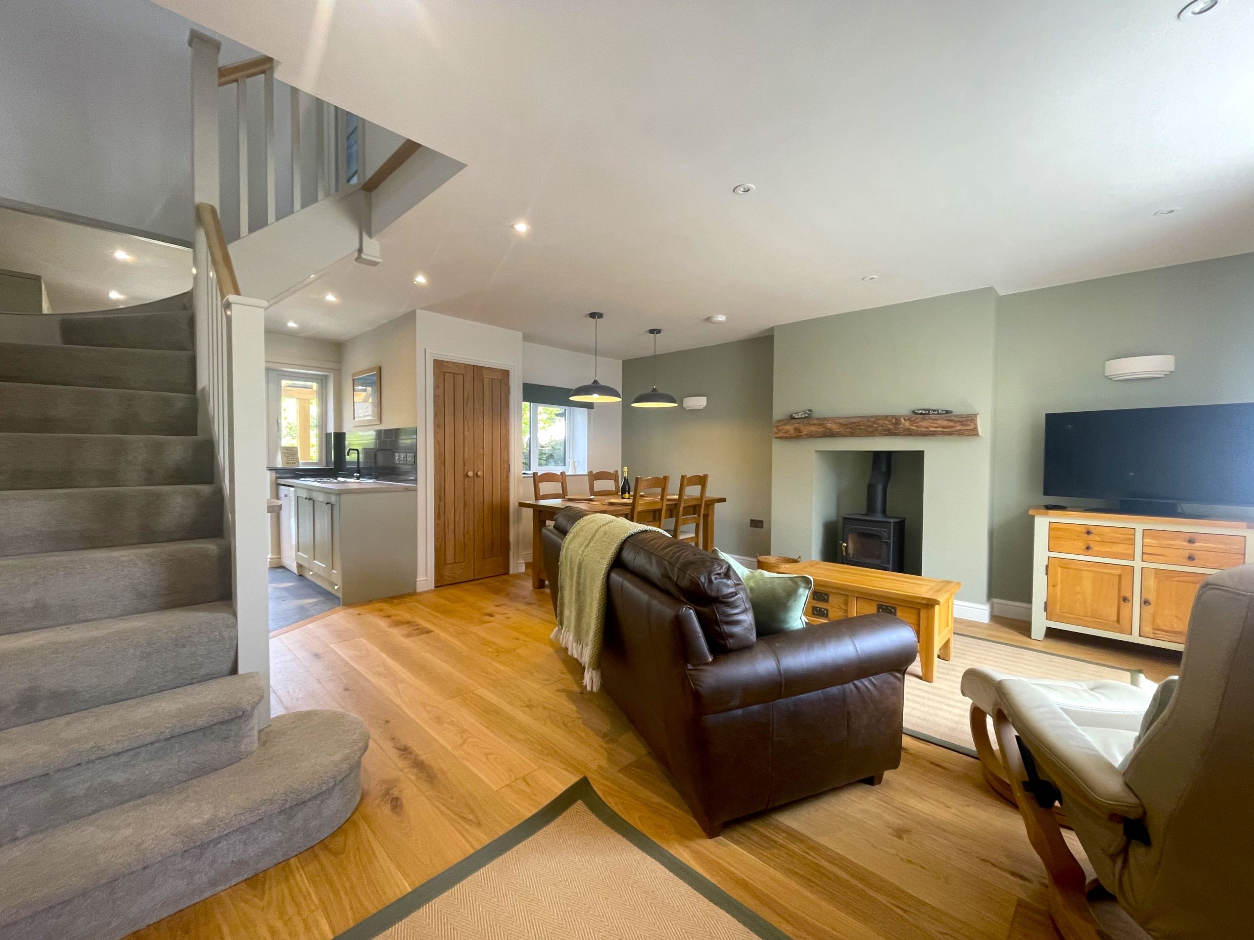 The log burning stove can be enjoyed from both the living and dining areas