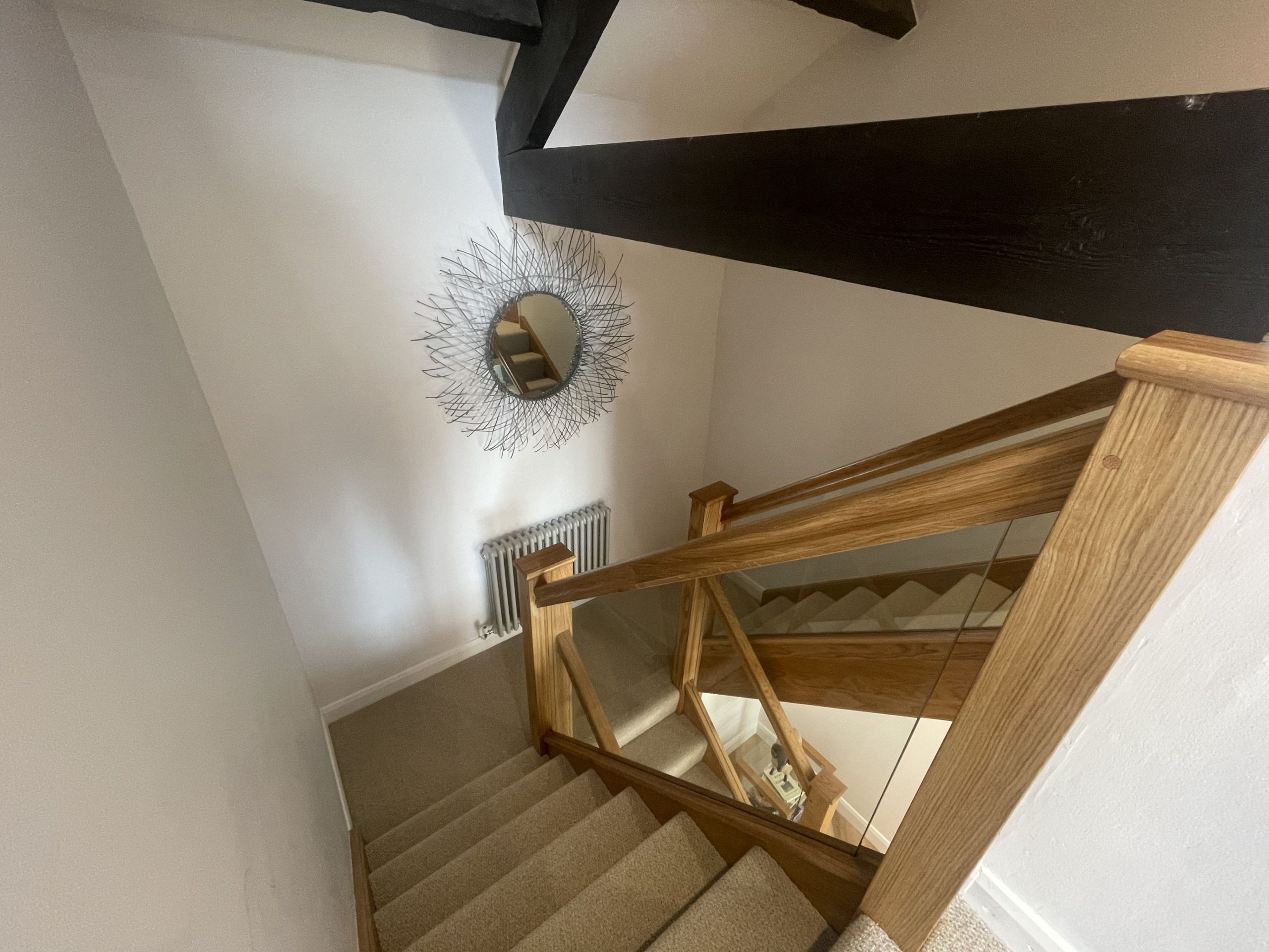 Each staircase leads to a bedroom and ensuite bathroom