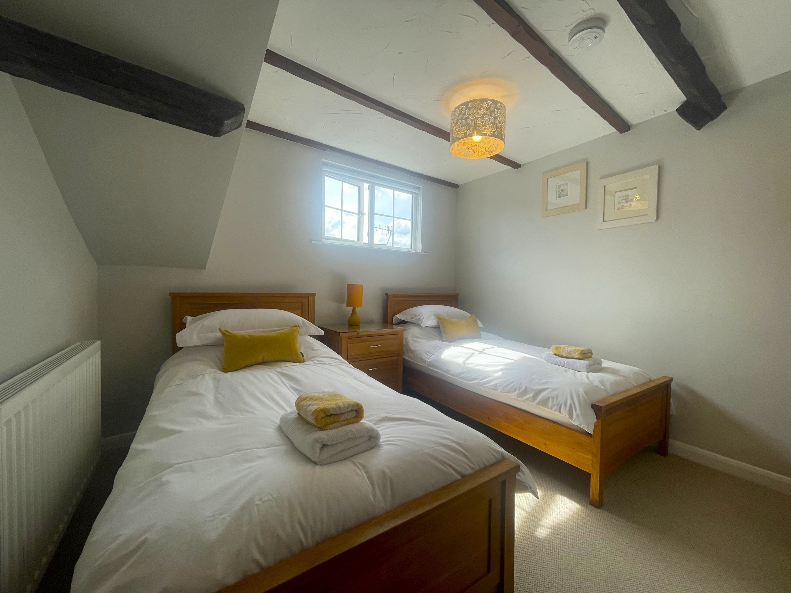 The bedrooms are cosy, sunny rooms in the eaves of the cottage