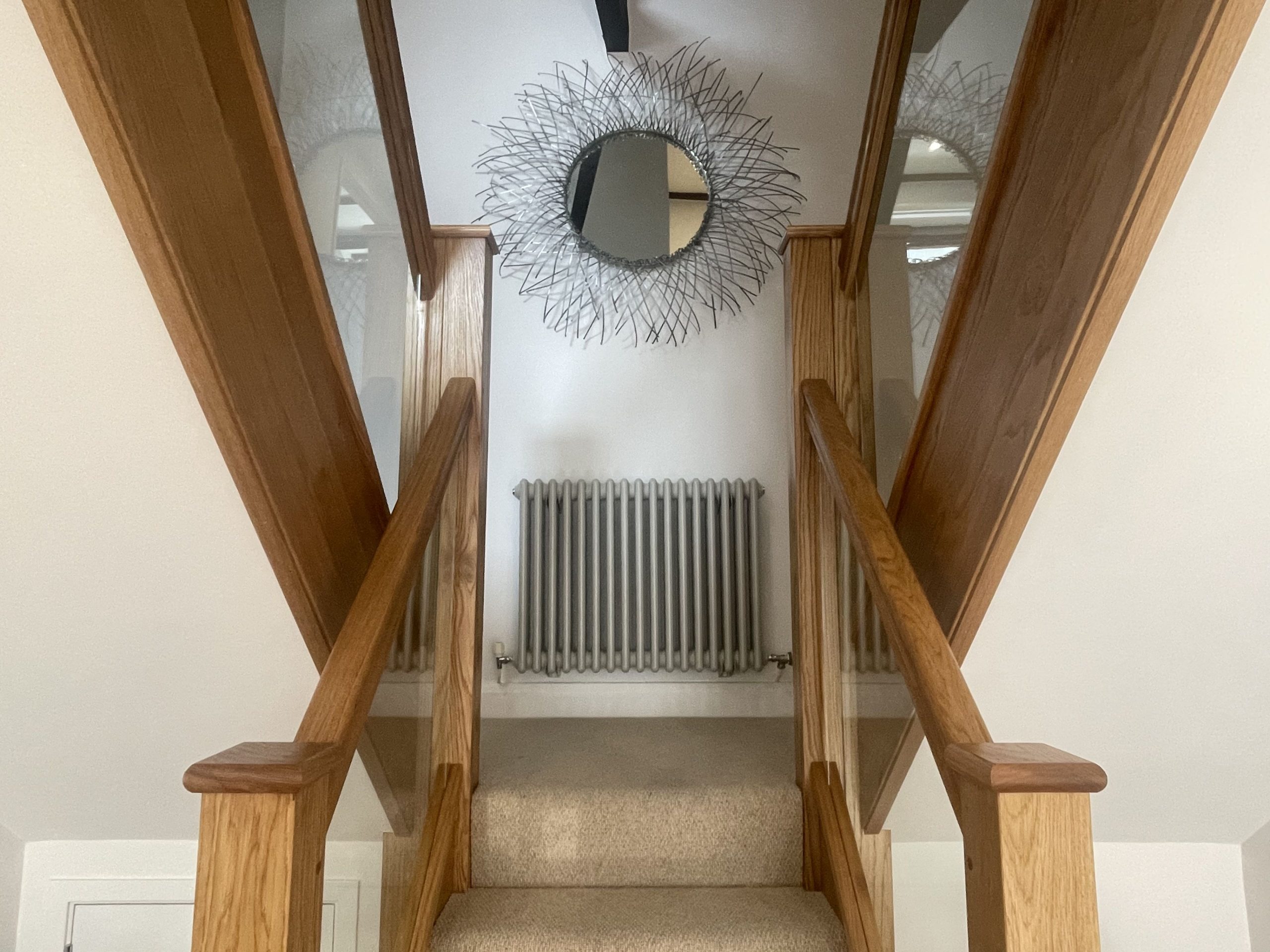 The double staircase leading to the bedrooms is an eye catching feature