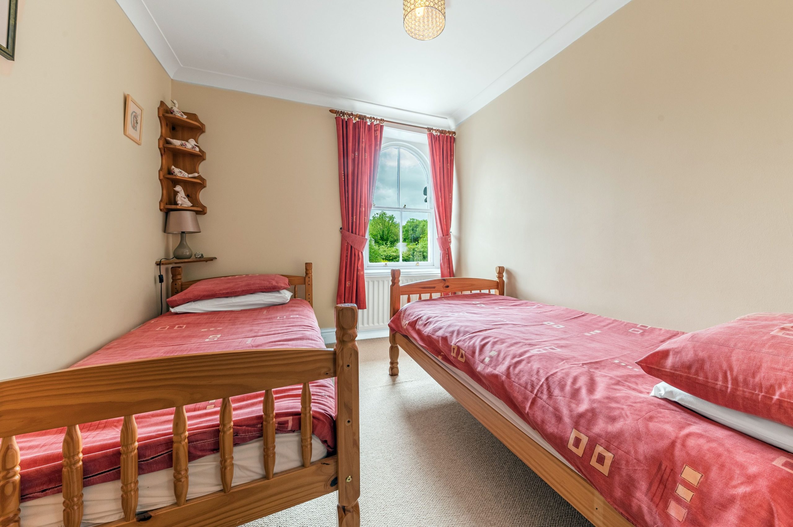 A comfortable twin bedroom with lovely views over Lake Road
