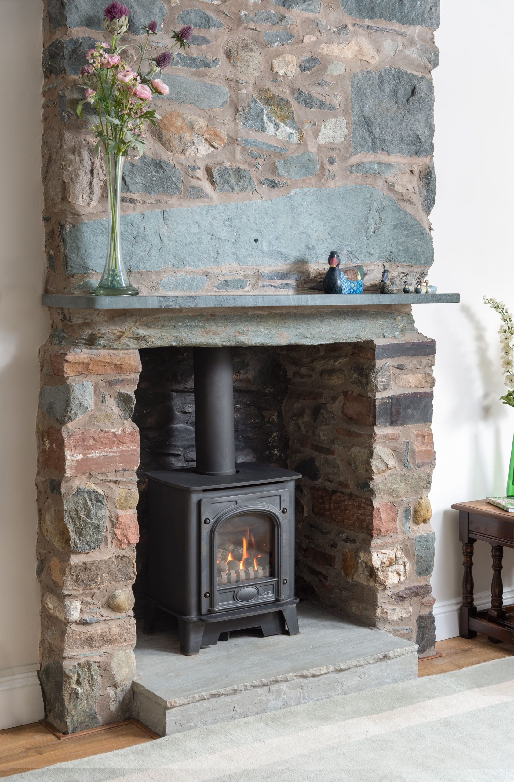 Stay warm and cosy next to the living flame gas stove