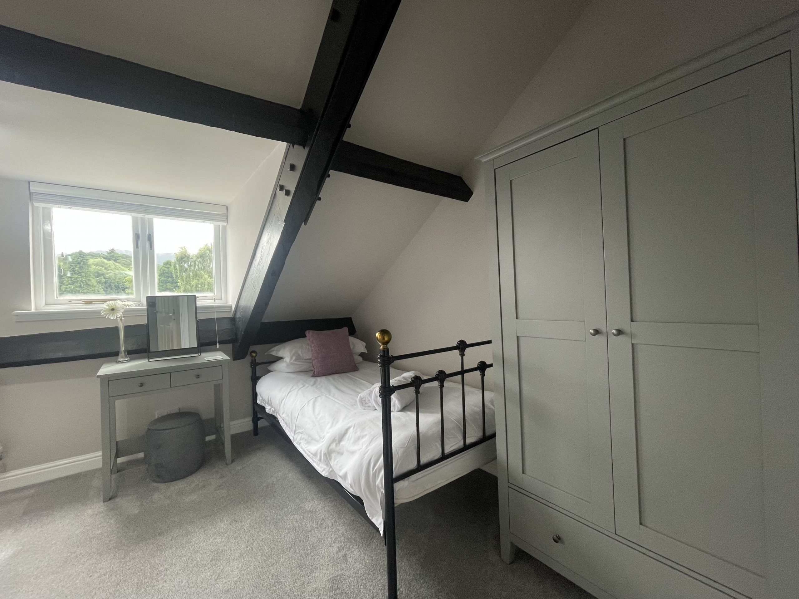 The second bedroom also comprises a single bed and large wardrobe
