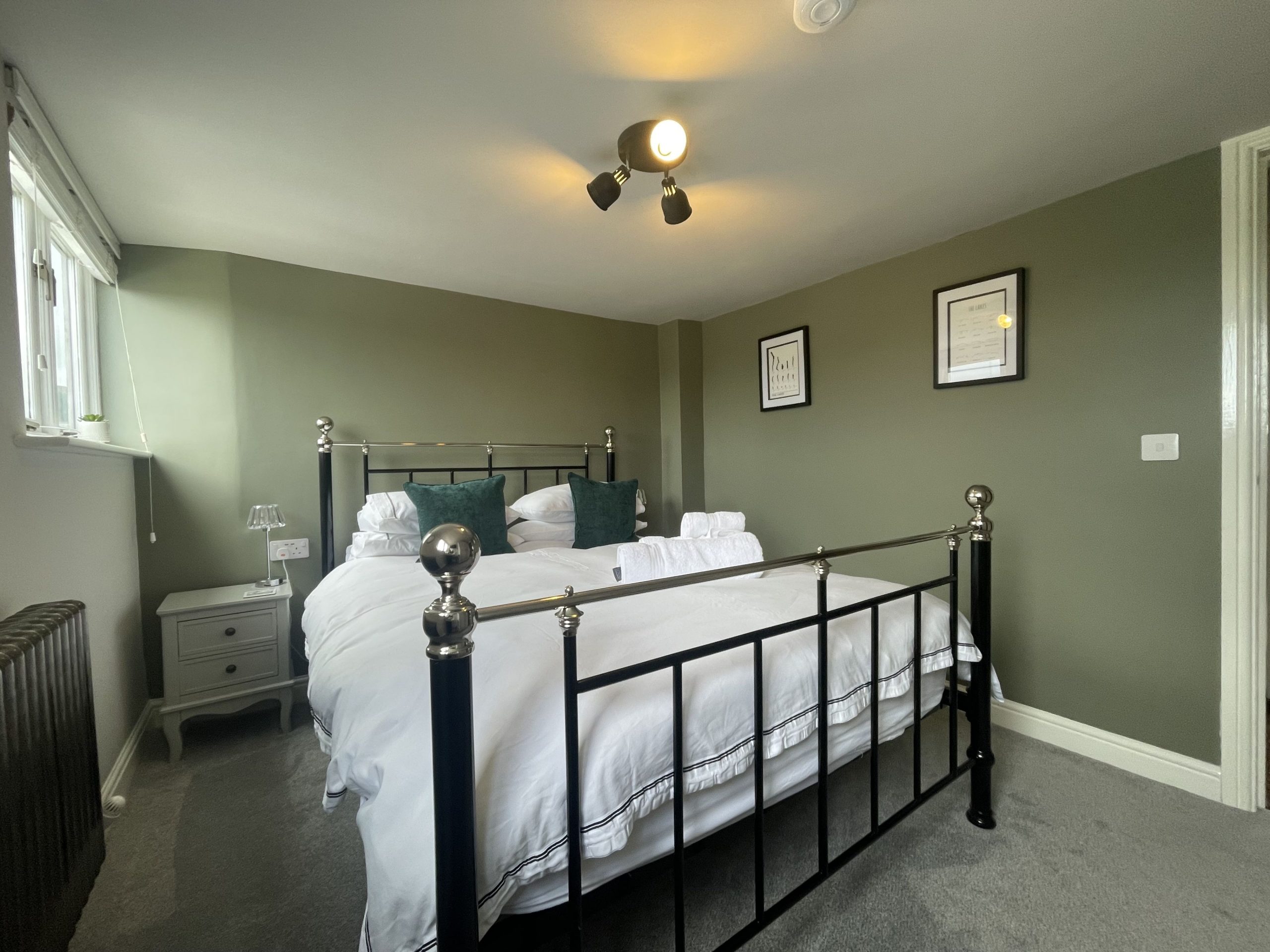 Beautifully decorated master bedroom wtih king bed