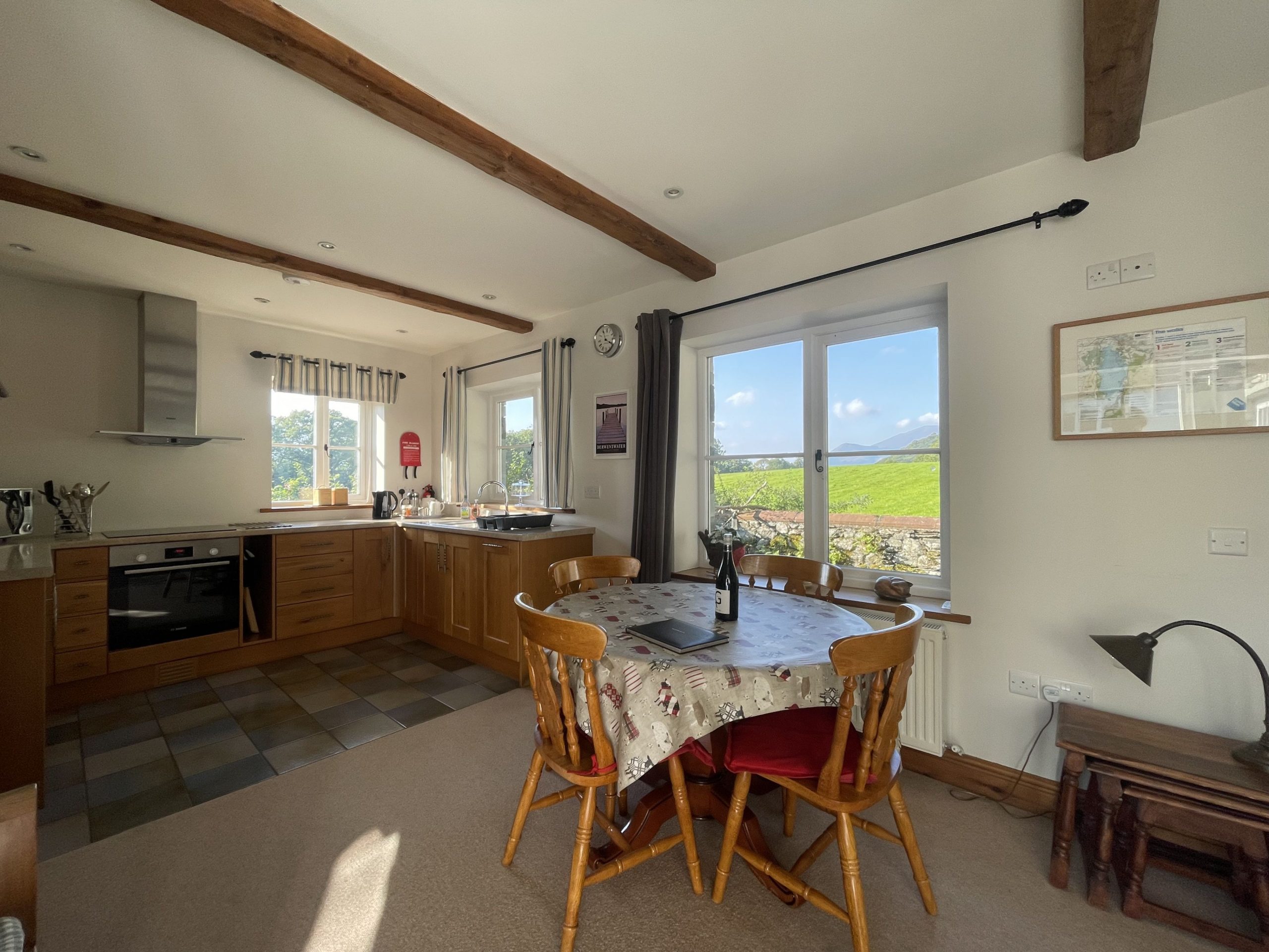 The spacious open plan living and dining area is the perfect spot to relax after a day exploring the Borrowdale Valley