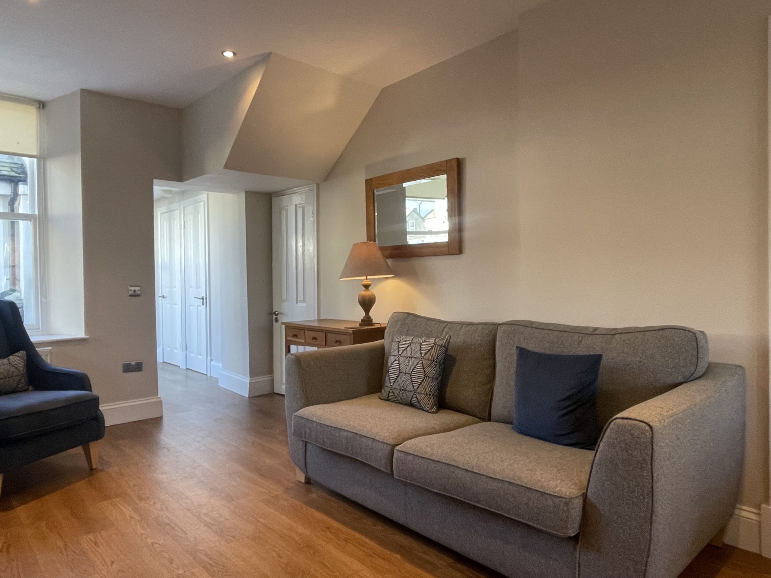 From the living room, you can access the kitchen and washing area