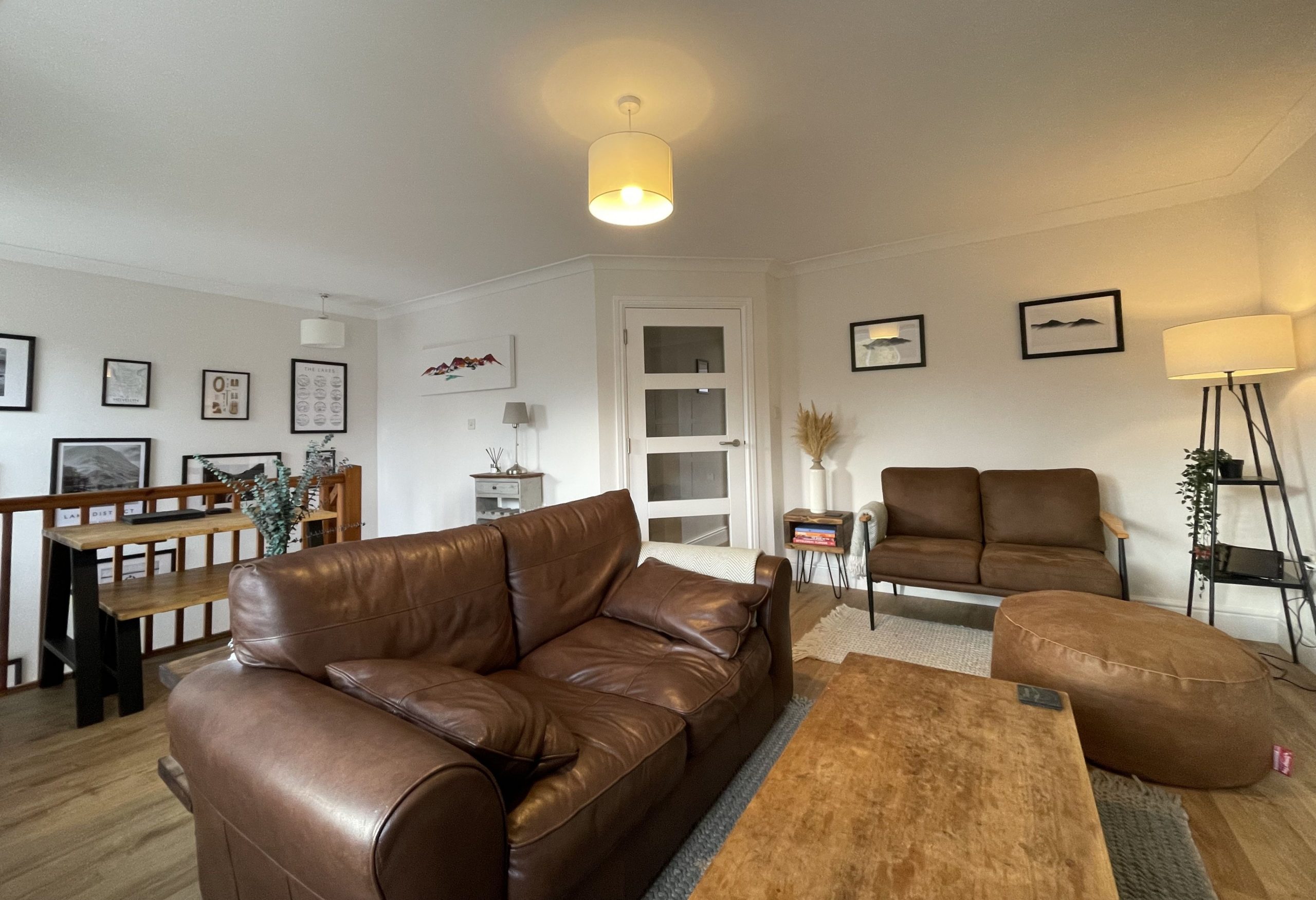 The living and dining area is on the second floor of the building and can be accessed from both the central foyer or from a second door from the communal hallway