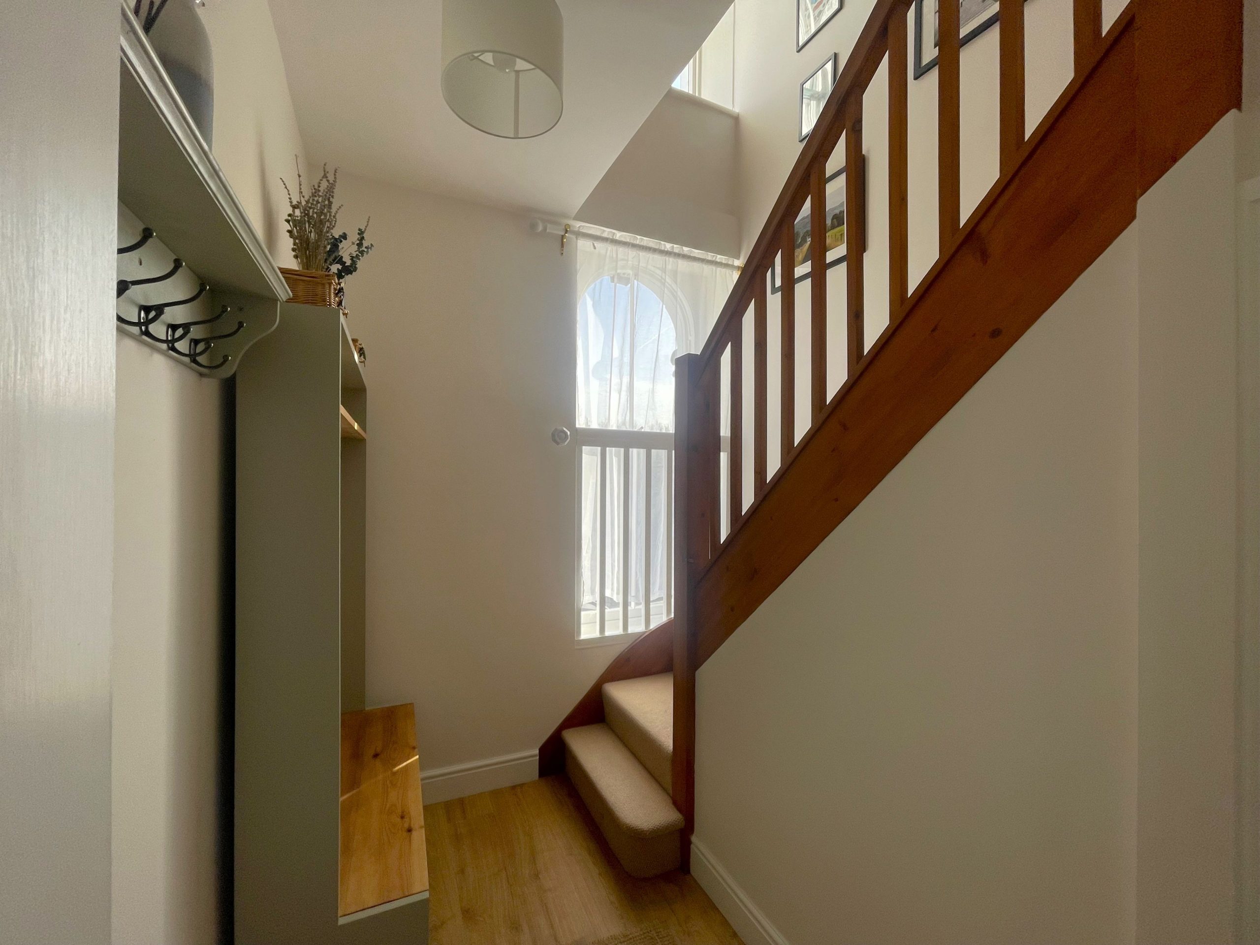 The impressive central foyer has plenty of space for coats and boots