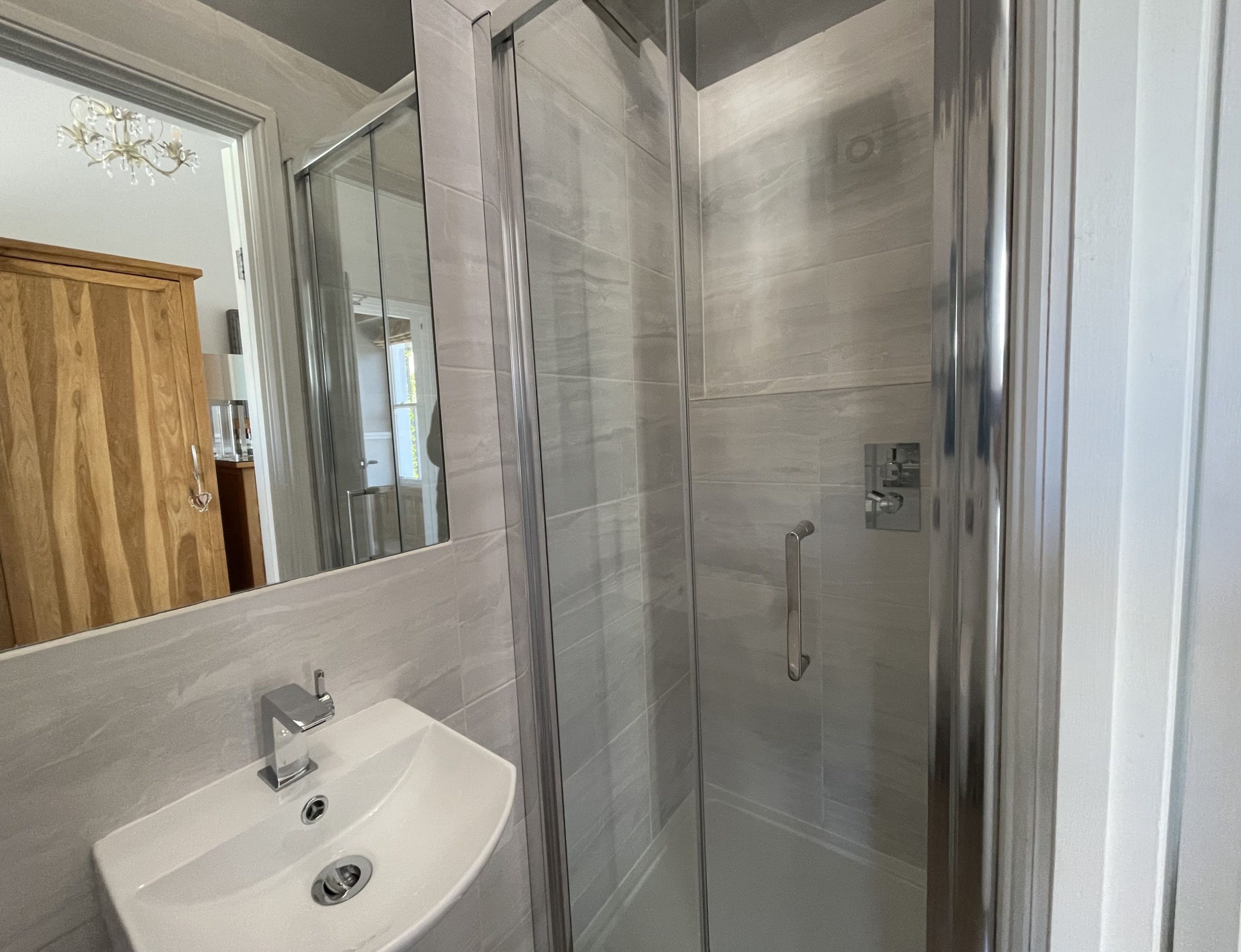 The master bedroom has is own modern ensuite shower room
