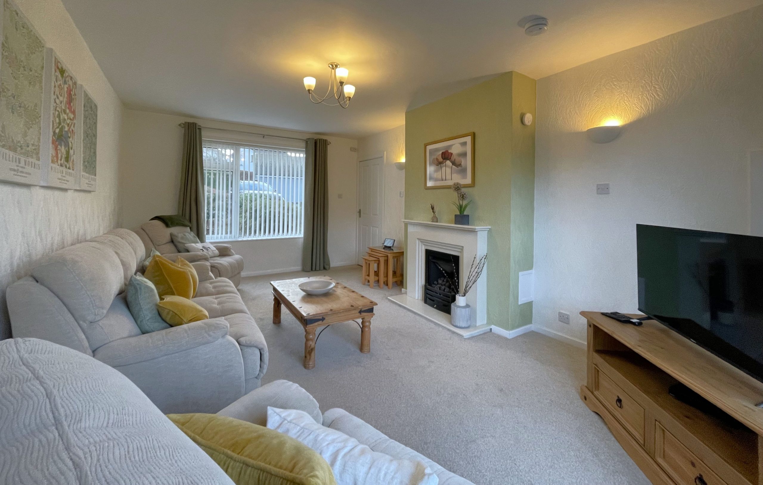 The lounge is a bright space with comfortable three piece suite and Smart TV