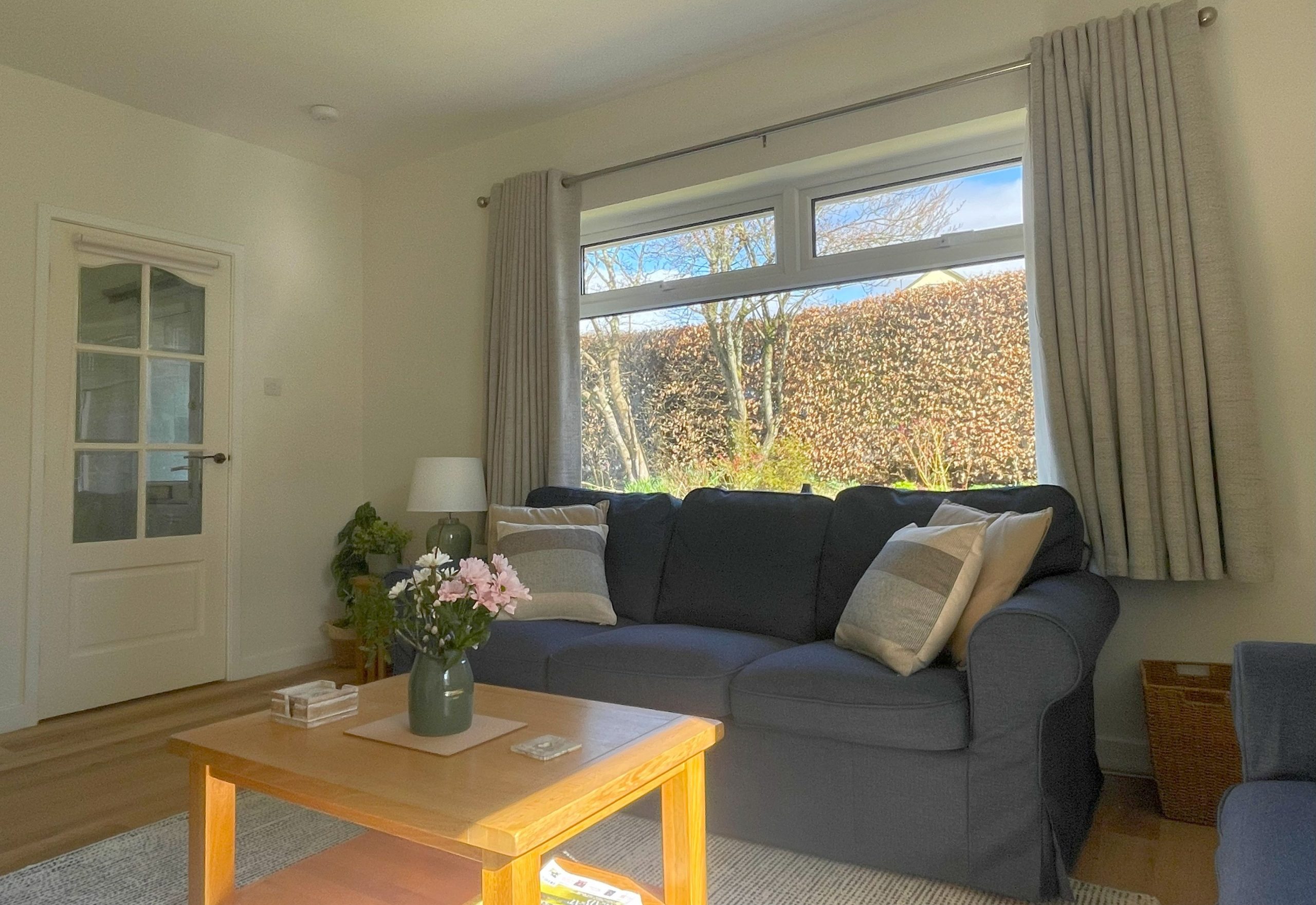 The two large windows overlook the private garden