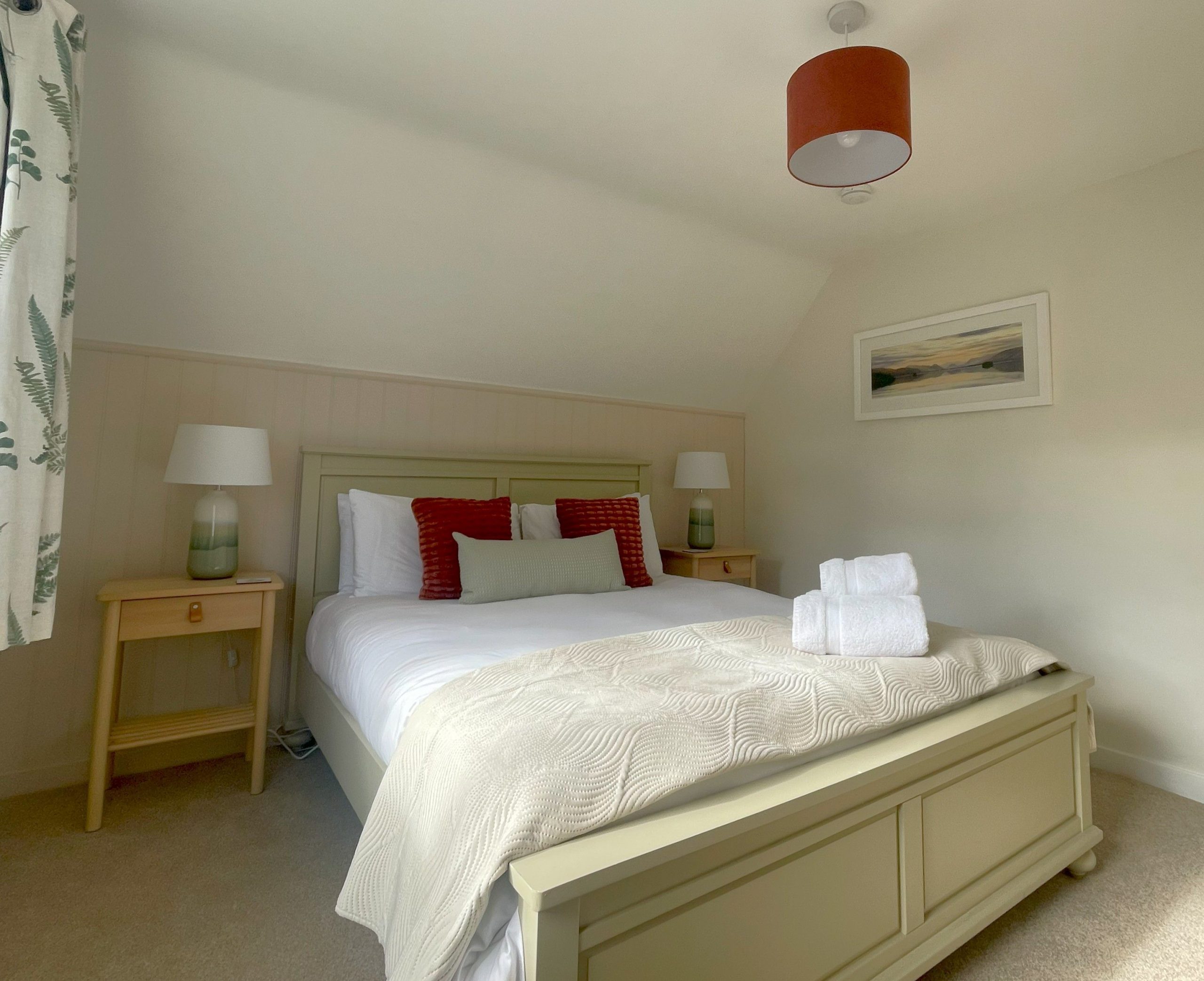 The master bedroom has a cosy modern feel