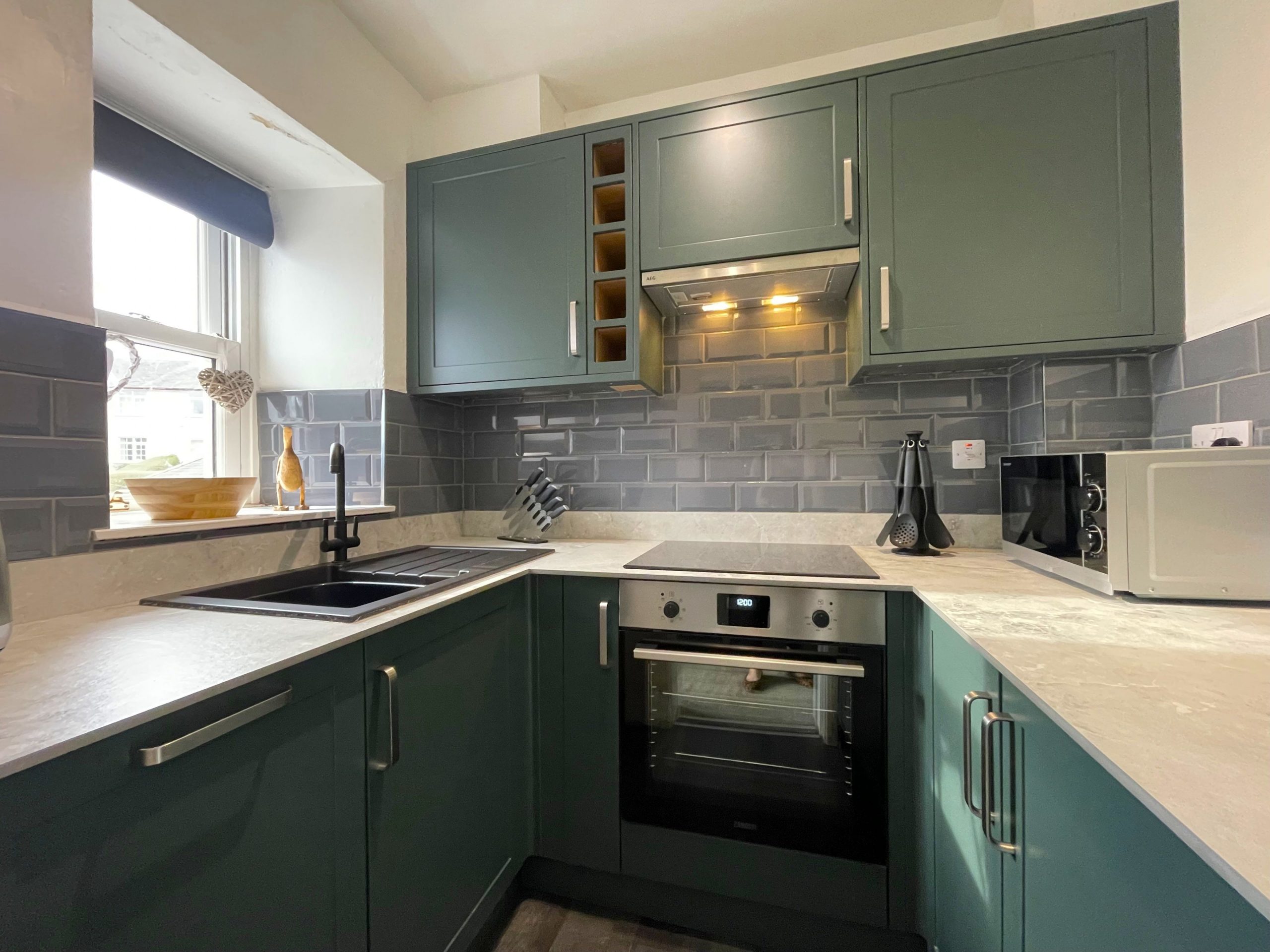 Brand new kitchen reflects the slate that is iconic to the Lake District