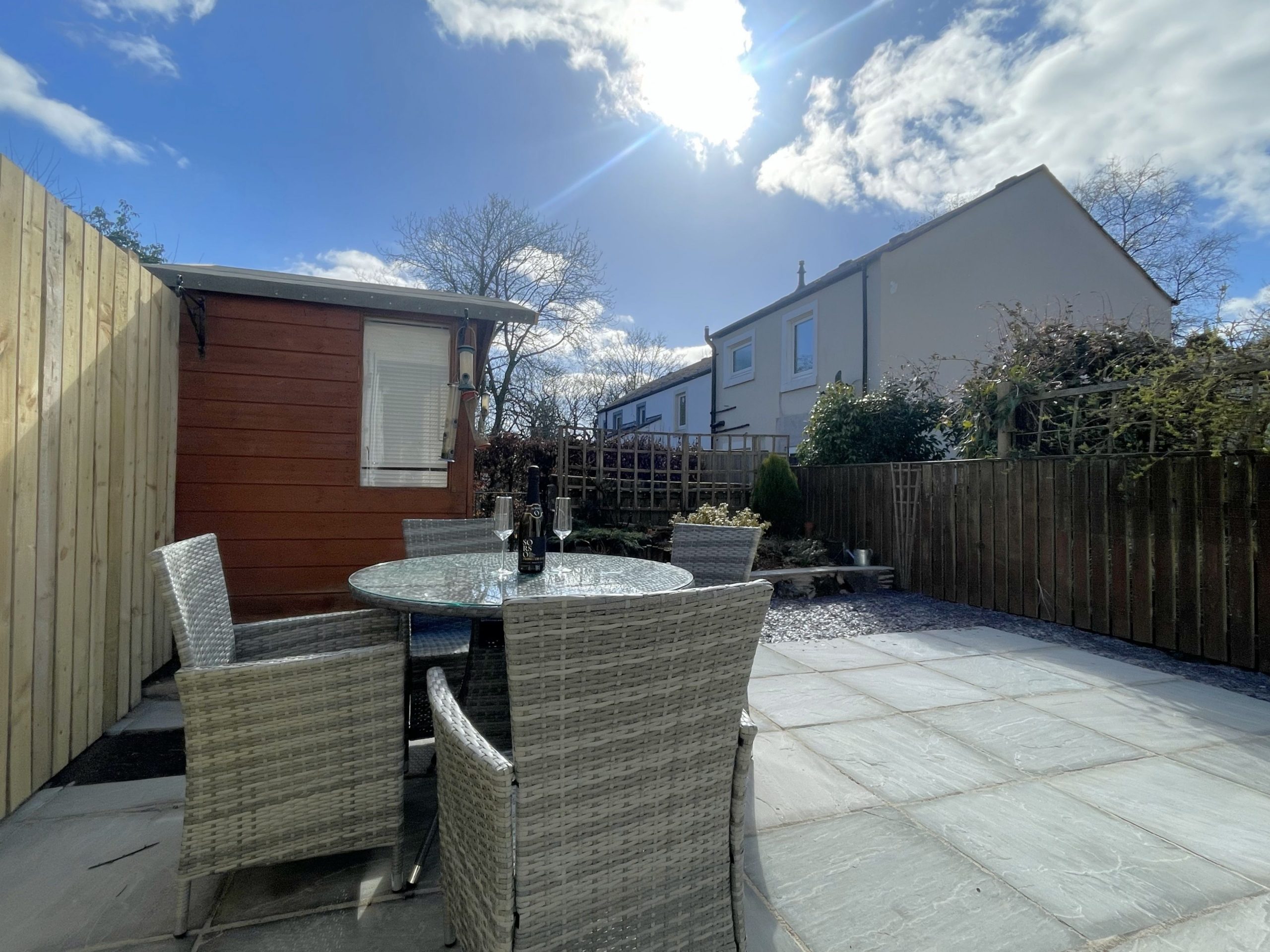 The gateway at the end of the garden leads to the back of the property and there is a pathway taking you along the River Greta.